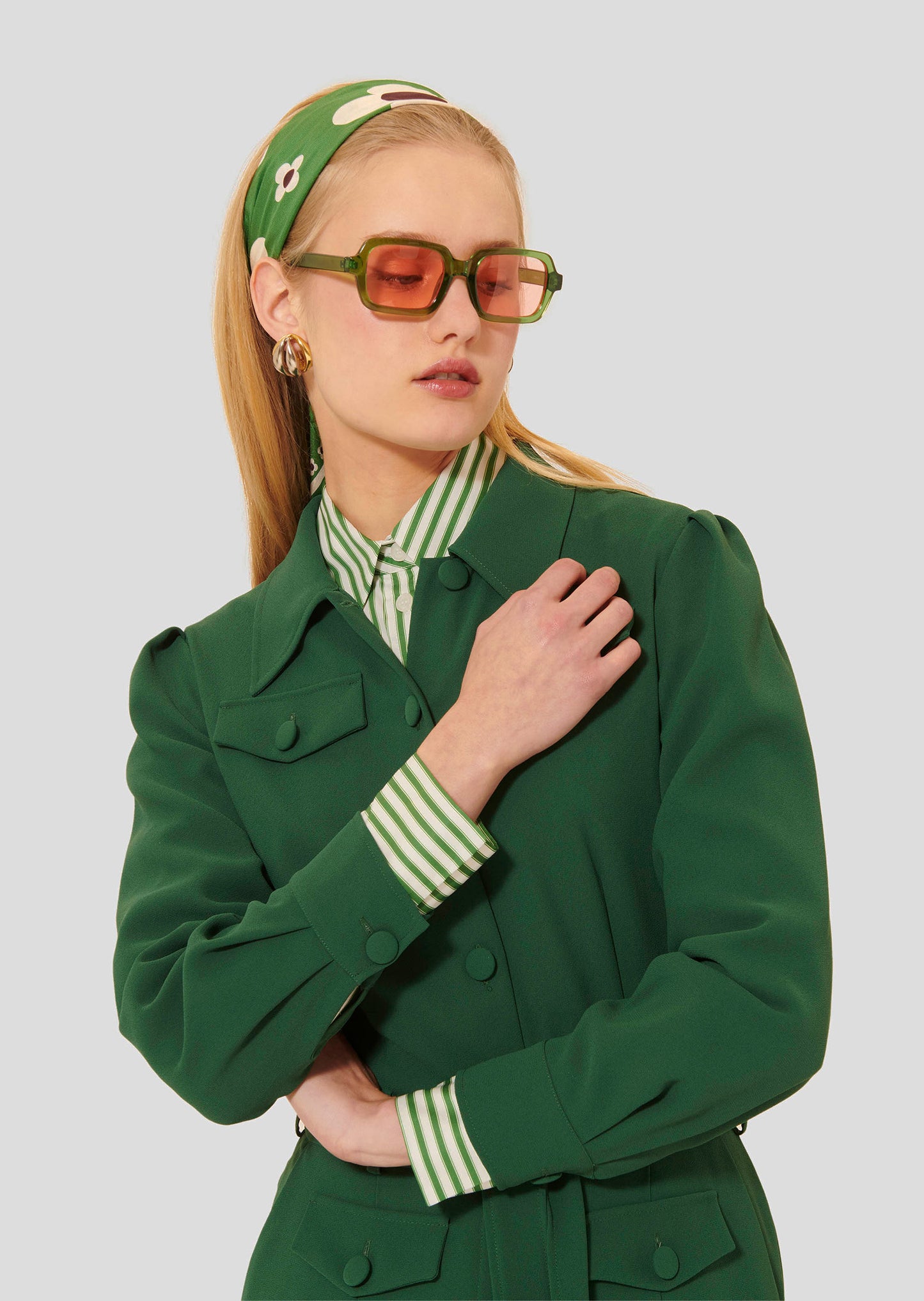 Model wearing Tara Jarmon crepe green jumpsuit.