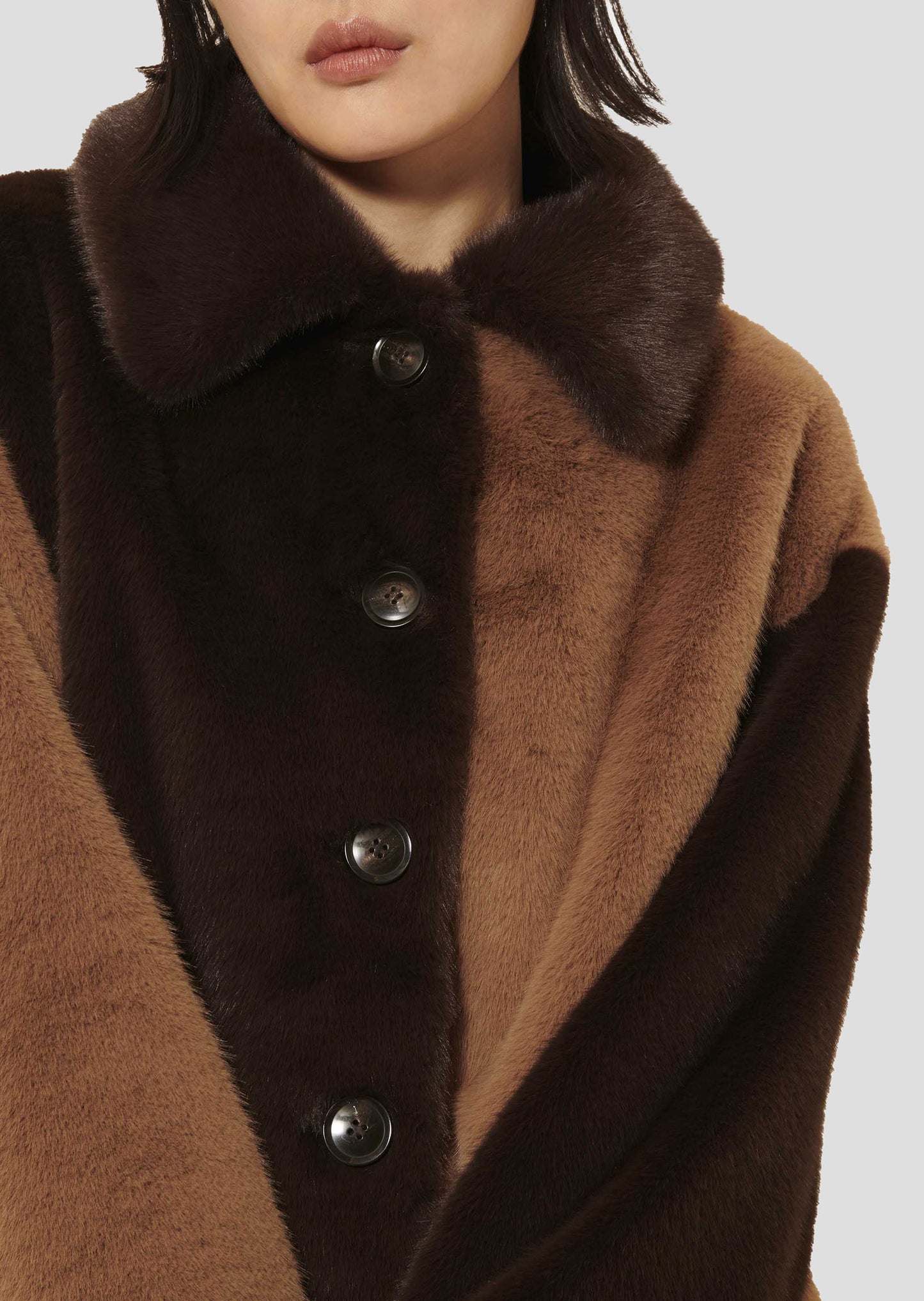 Short Faux Fur Coat in Chocolate with Side Pockets.