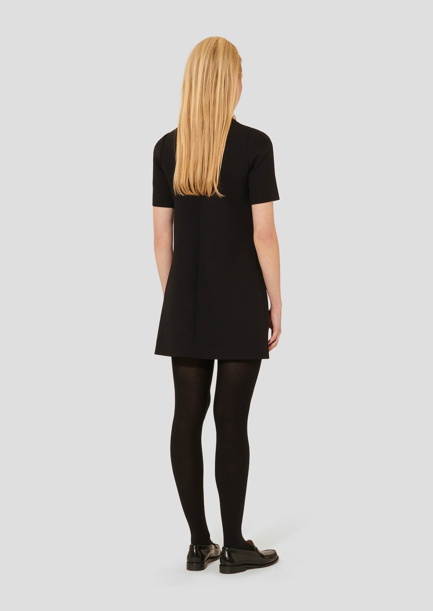 Straight cut short black dress.