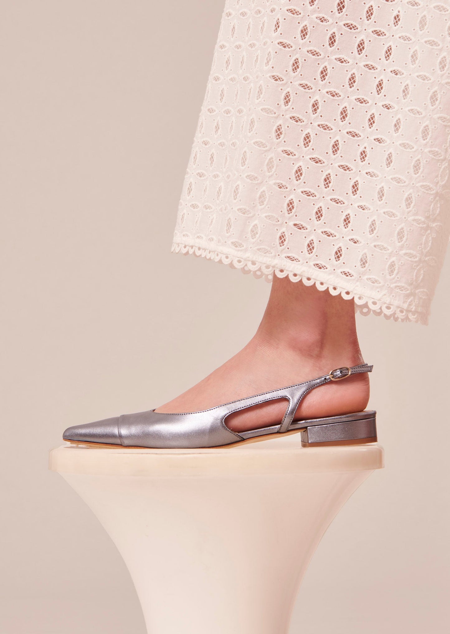 Blue Metallic Pointed-Toe Pumps with Adjustable Strap.