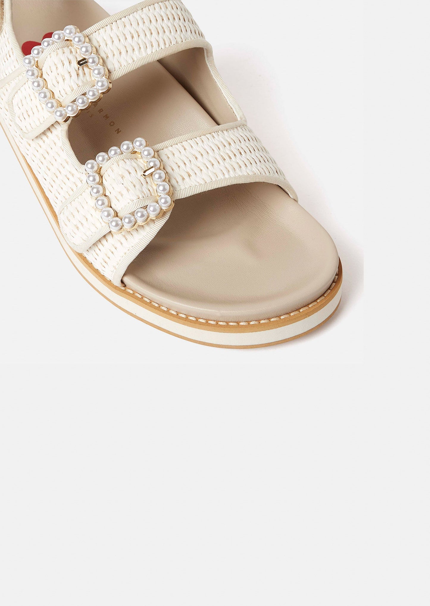 Ecru Flat Sandals with Adjustable Straps and Beaded Accents.