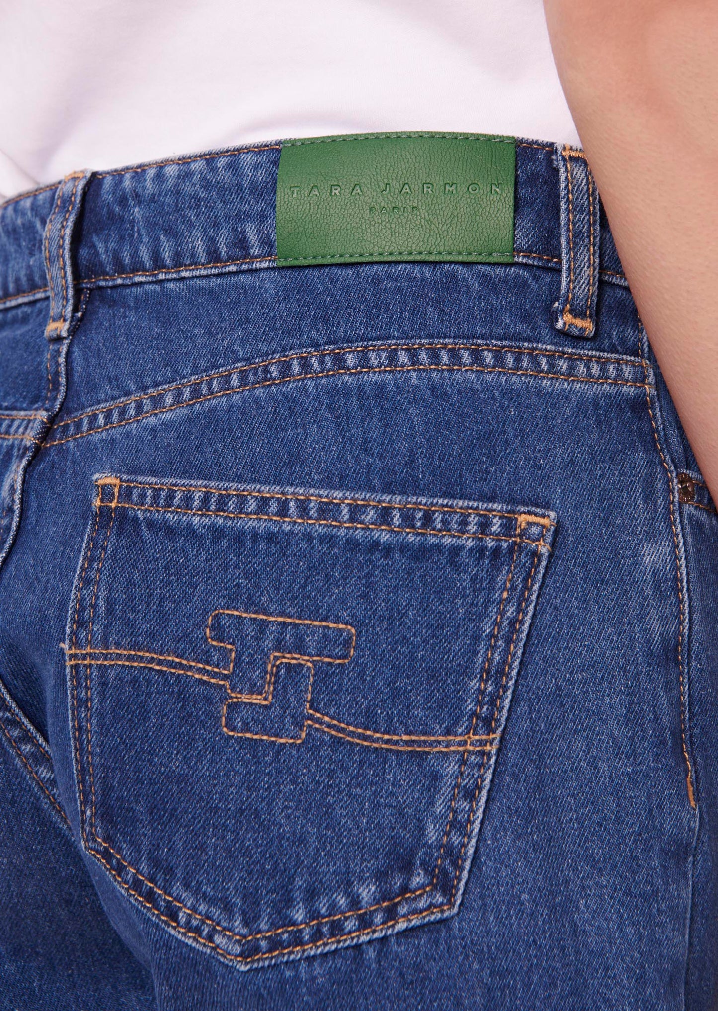 Blue denim jeans with Tara Jarmon embroidered logo.