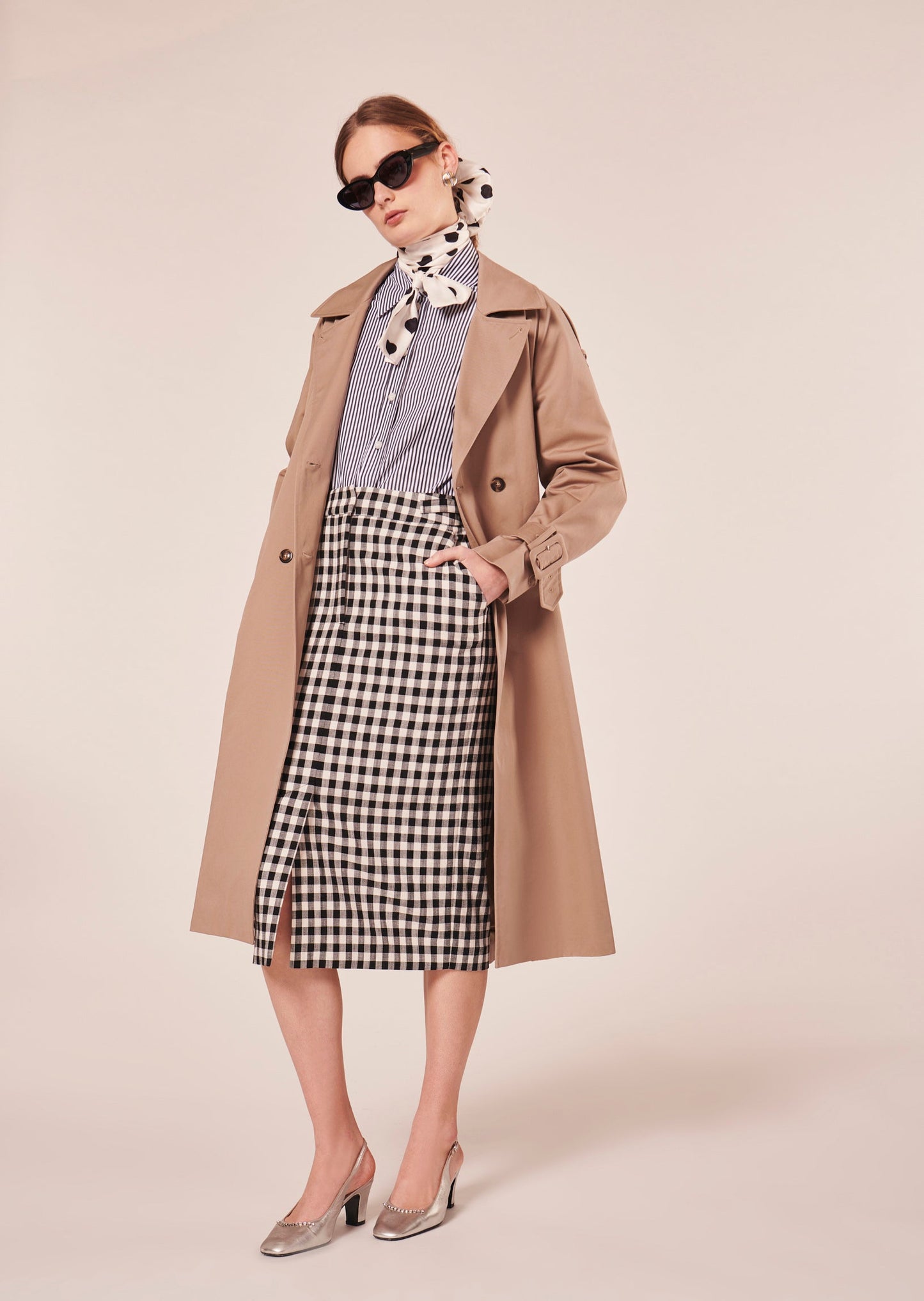 Black gingham pencil cut skirt with a slit at the front.