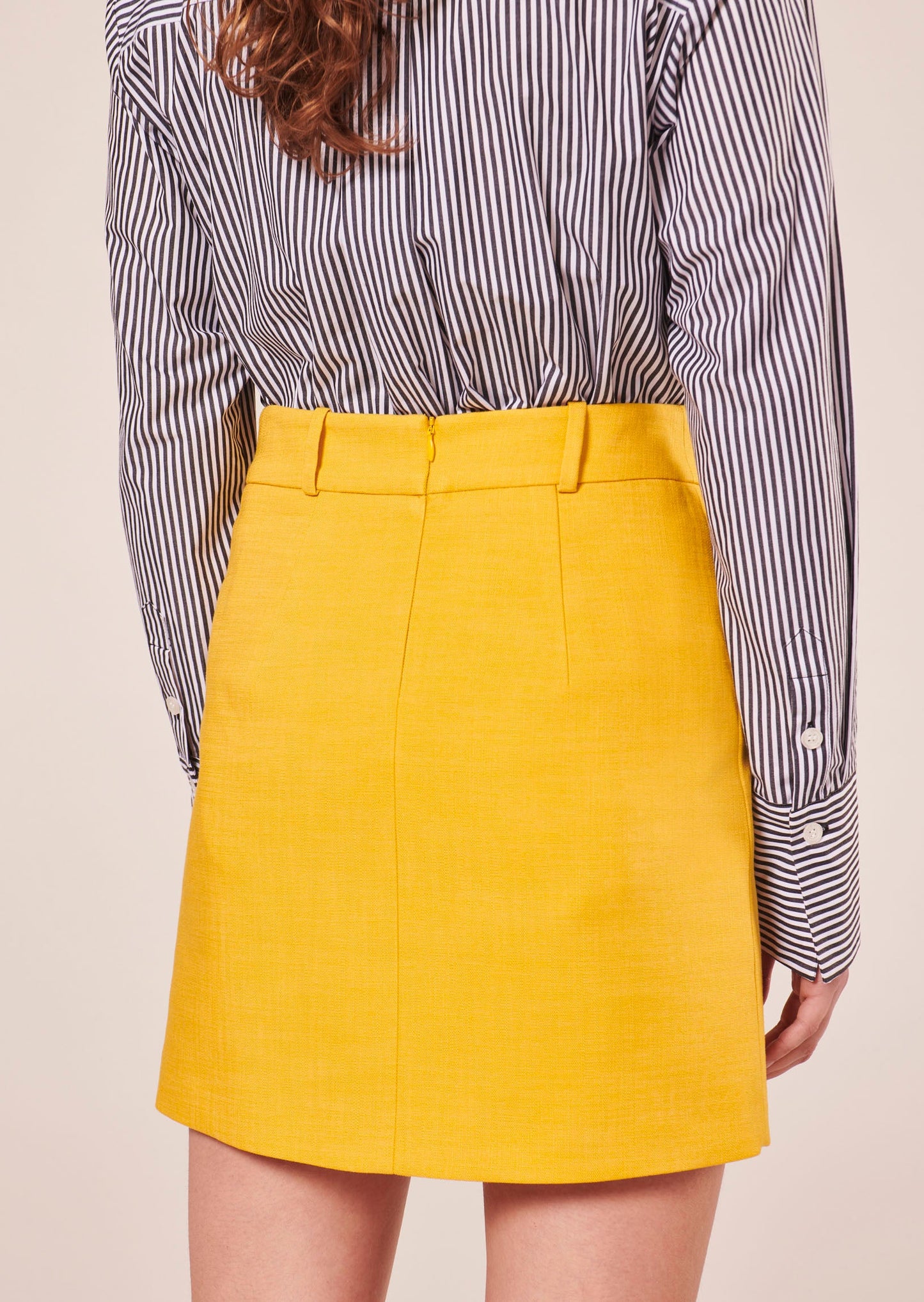 Yellow viscose straight cut skirt with invisible back zip.
