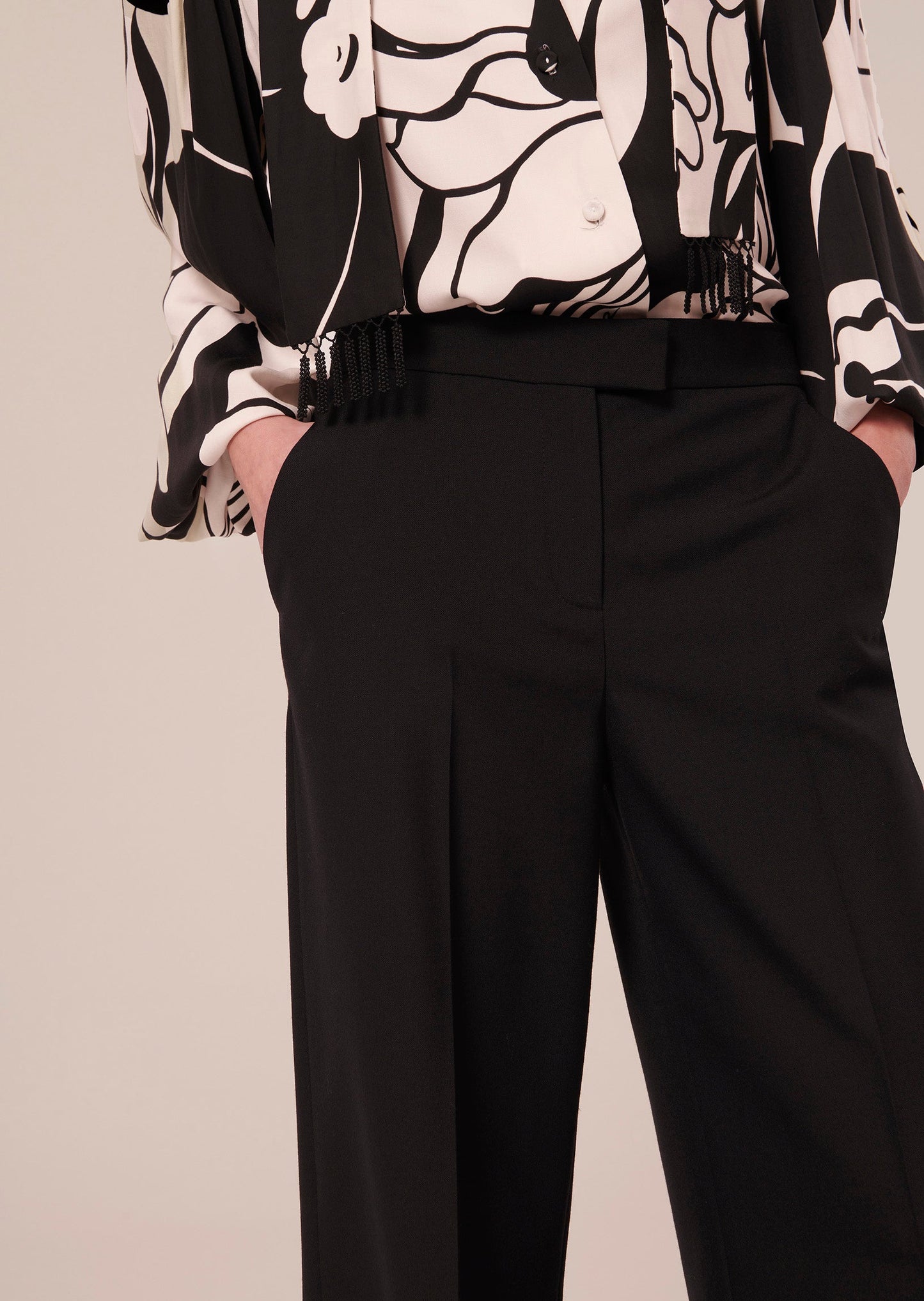 Black cold wool, wide flared cut pants, with side pockets.