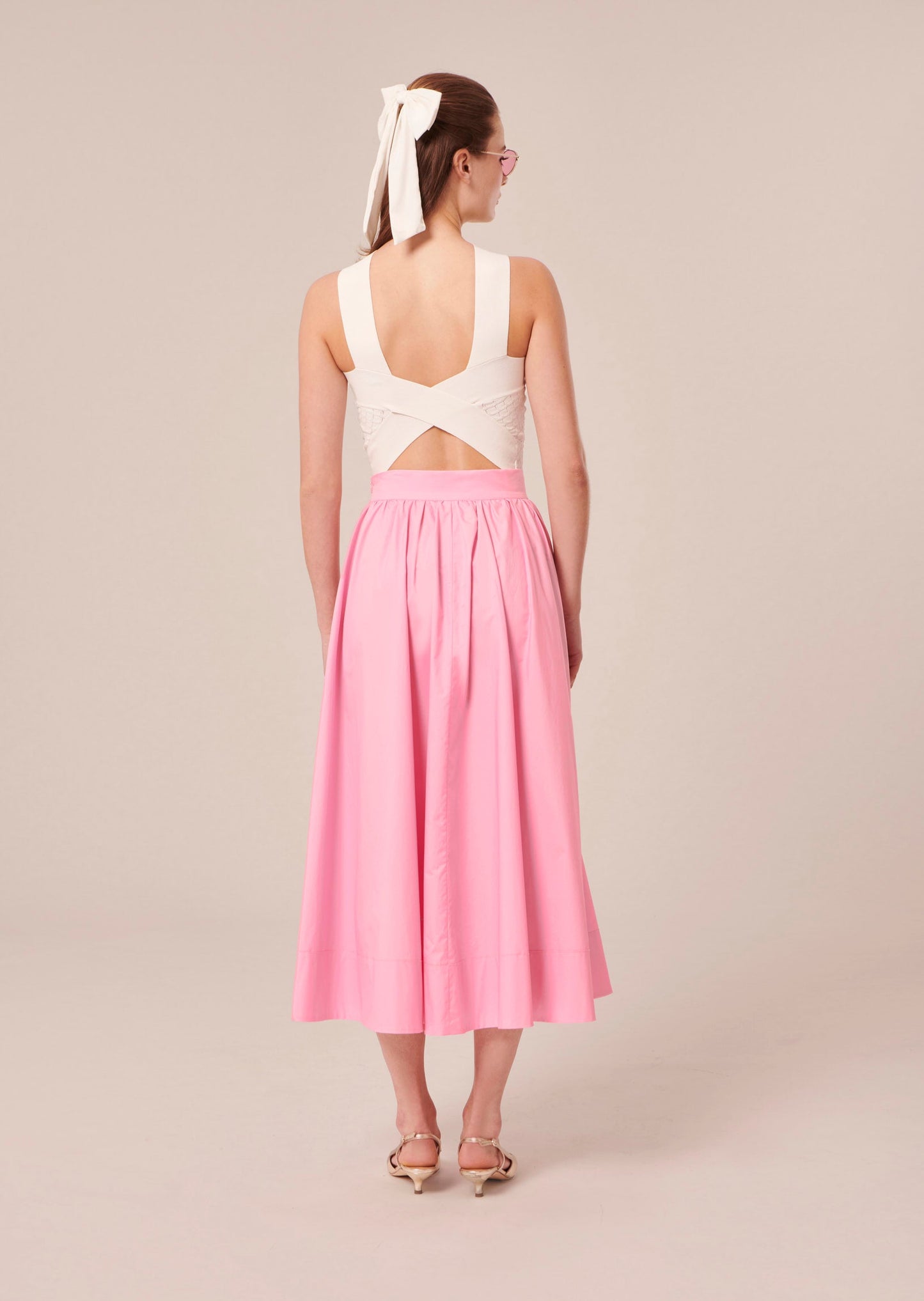White crop top with elegant revealing back.
