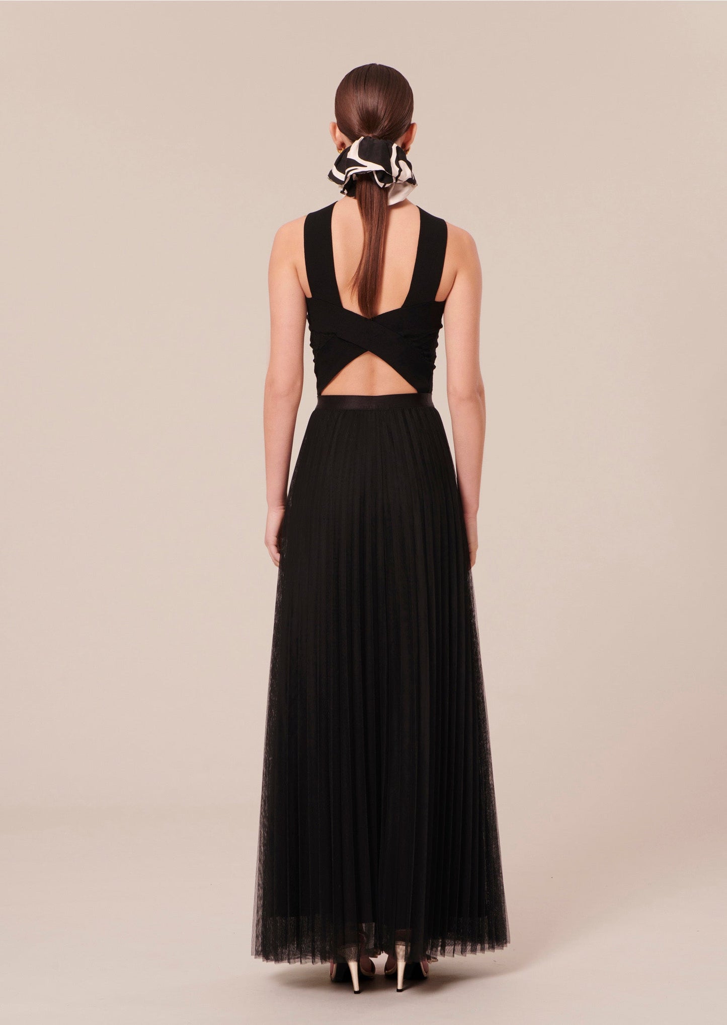 Black crop top with elegant revealing back.