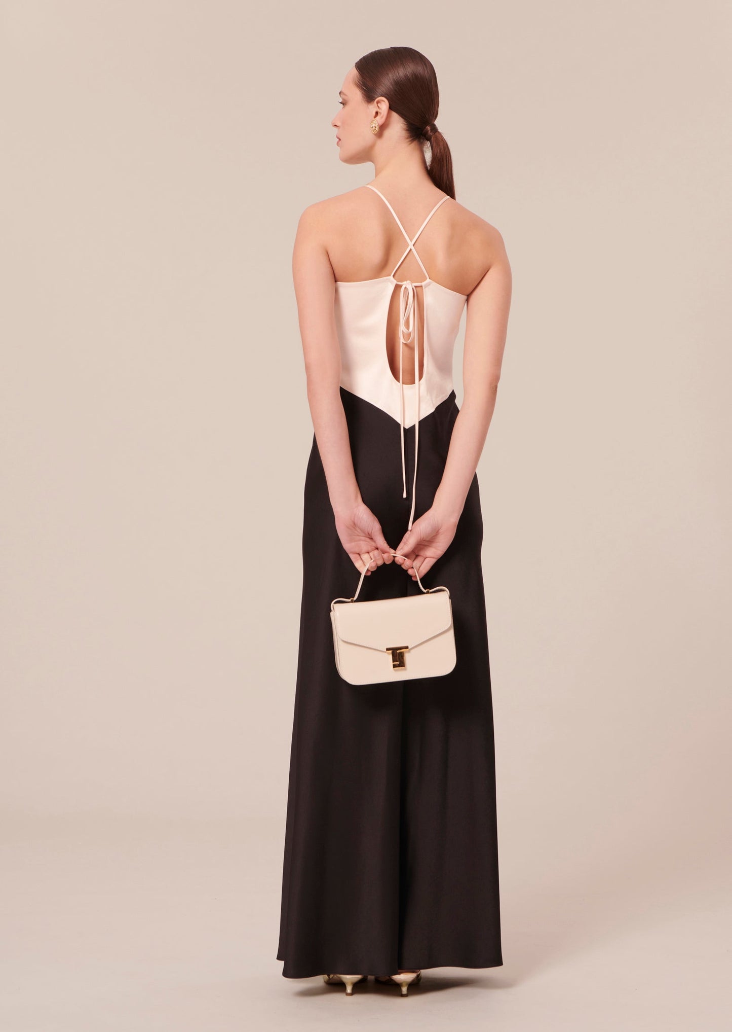 Black and white long satin dress with adjustable straps.