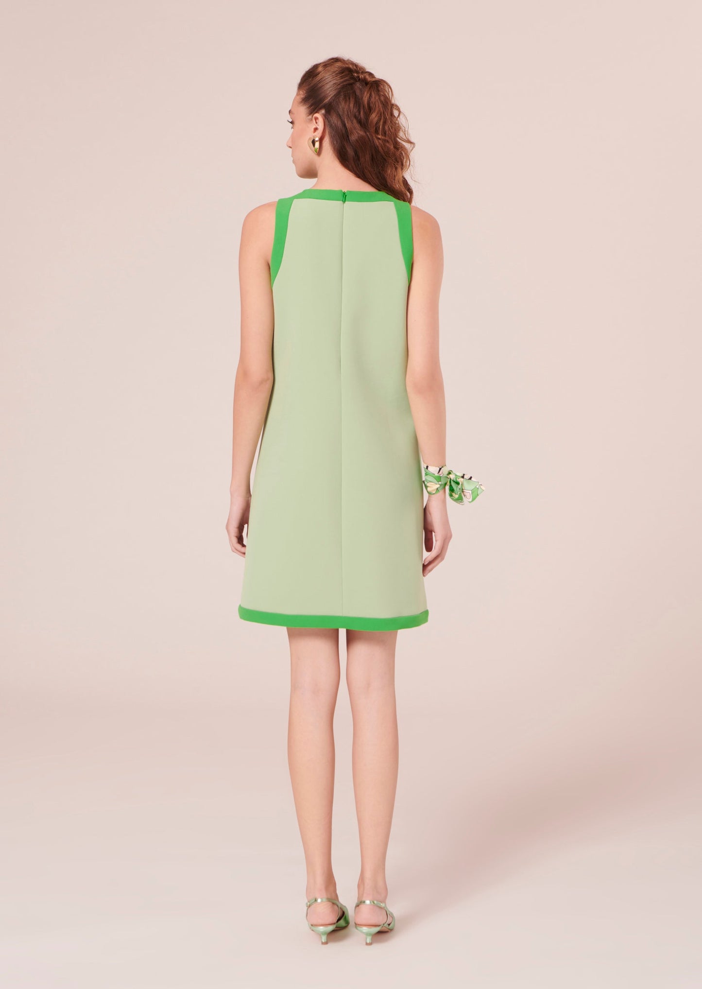 Straight cut sleeveless, short green dress.
