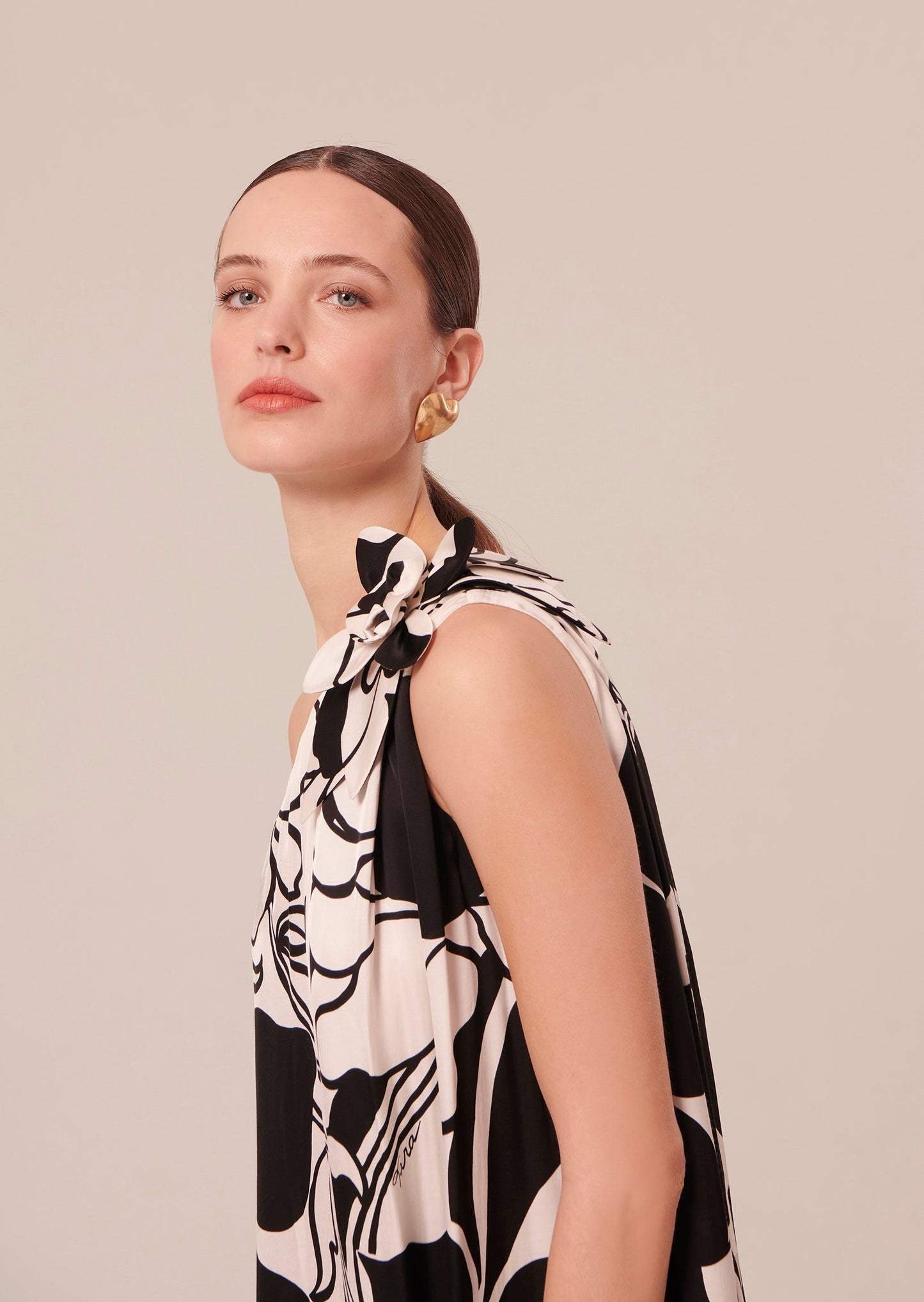 Flowing Floral Maxi Dress in Cream Color with Asymmetrical Neckline.