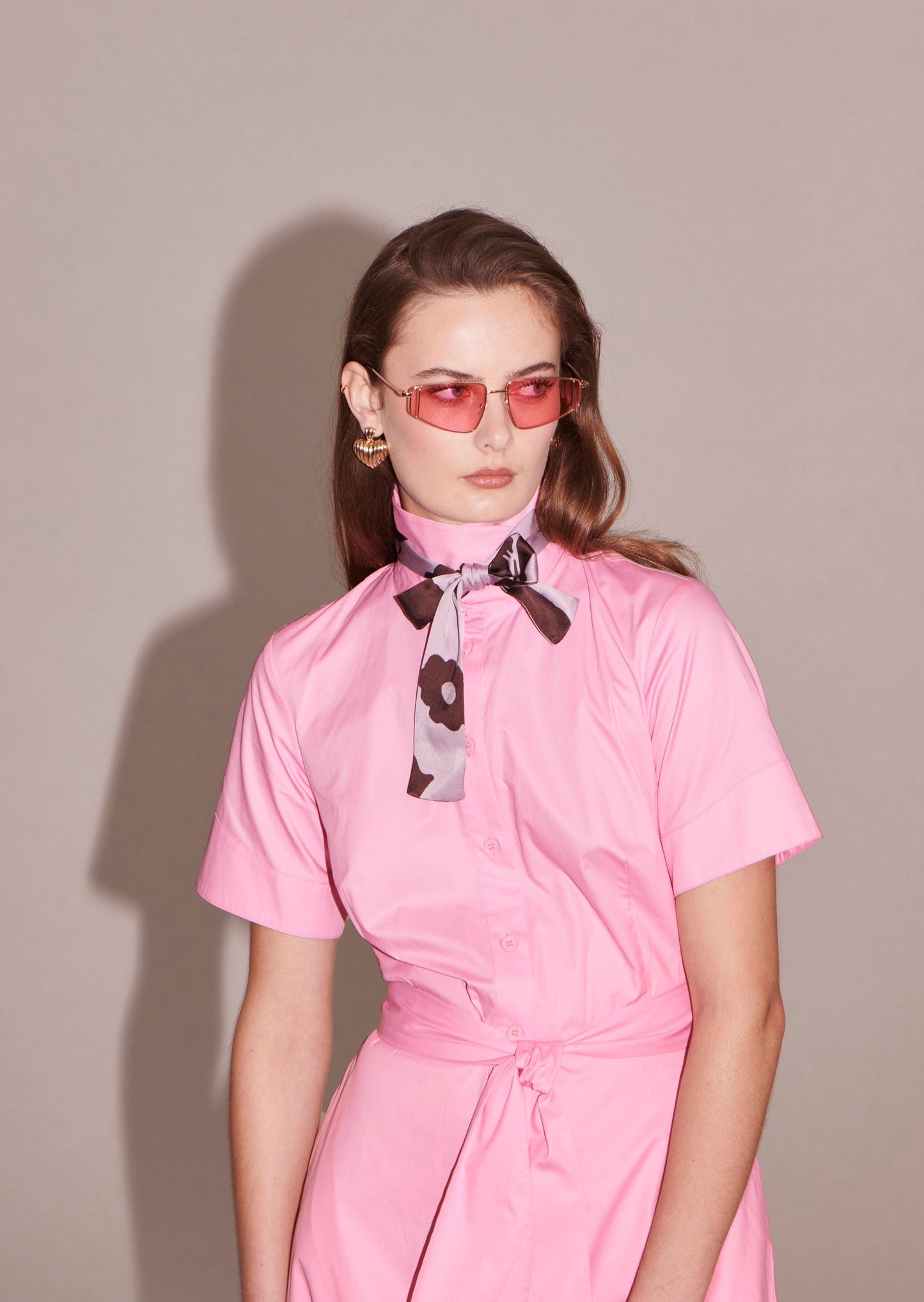 Model wearing Tara Jarmon Cotton Pink Poplin Shirt Dress with Belt and Side Pockets.