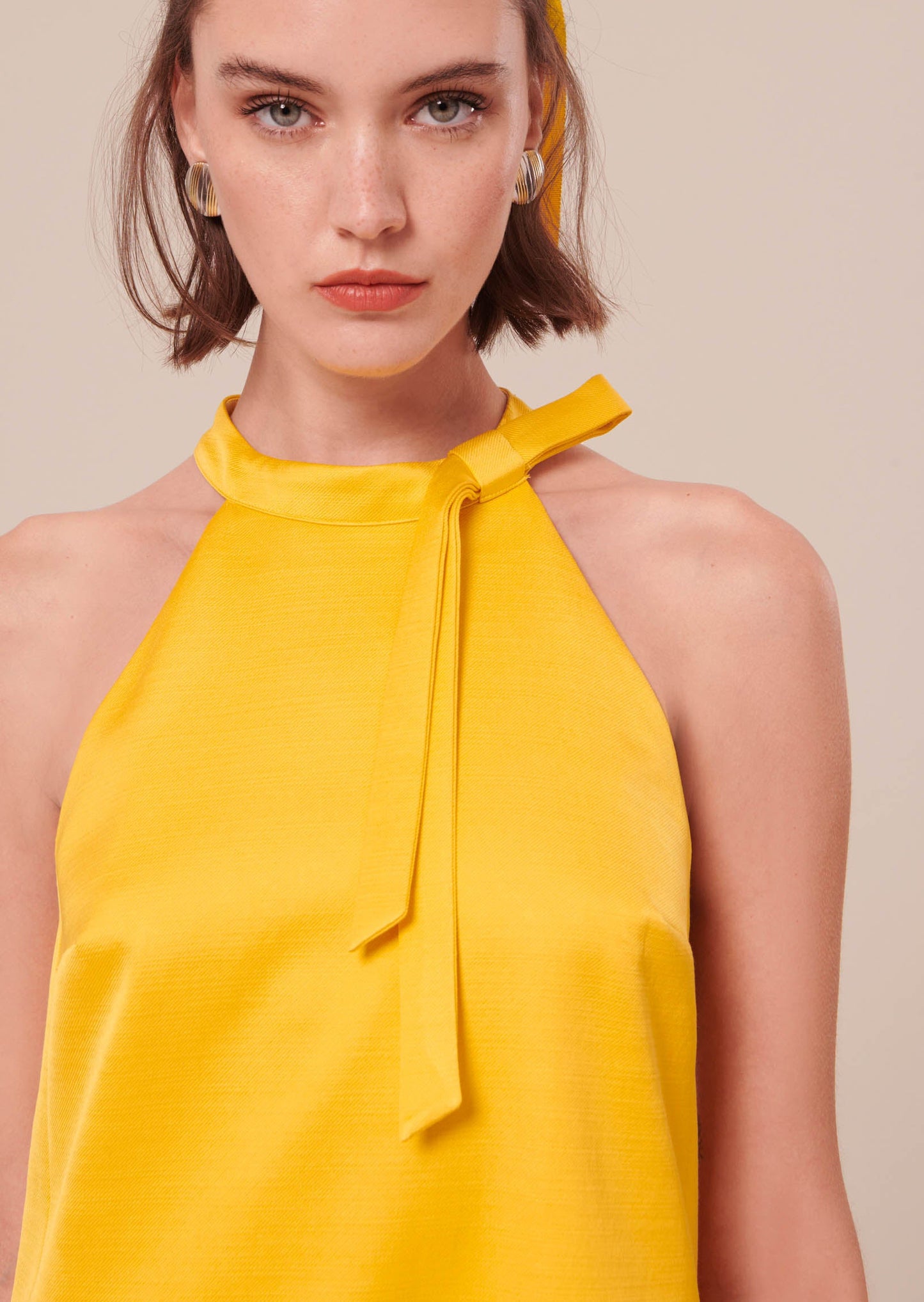 Sleeveless Yellow Satin Dress with Tie Neckline.