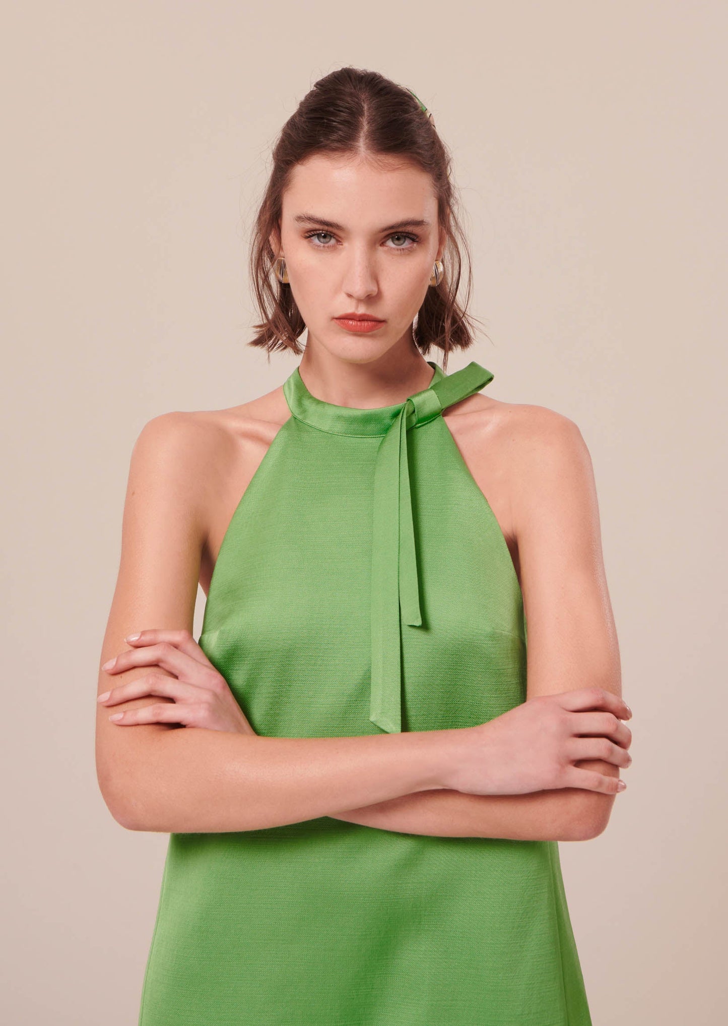 Sleeveless Green Satin Dress with Tie Neckline.