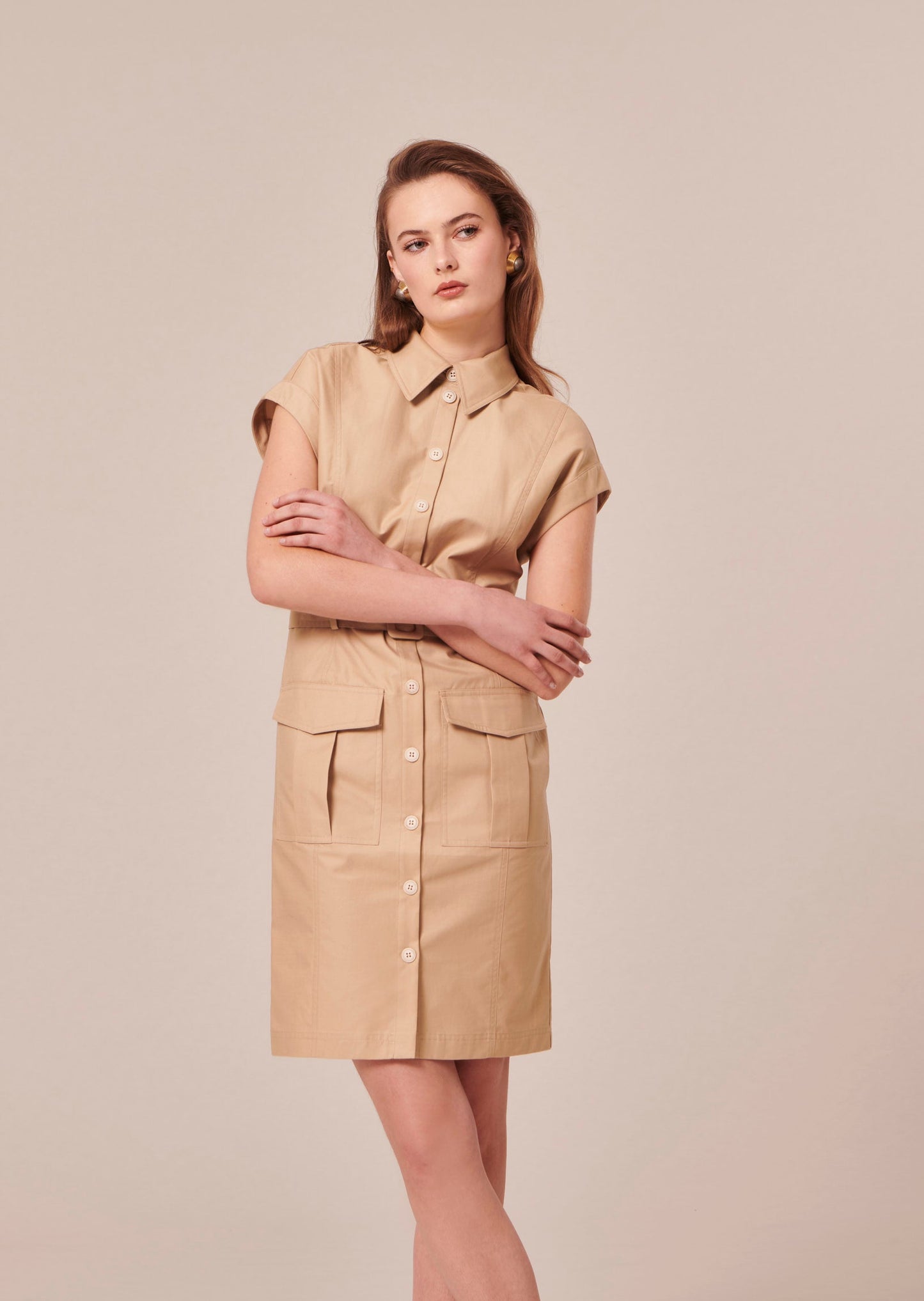 Model wearing Tara Jarmon Beige Cotton Shirt Dress with Belt and Flap Pockets.