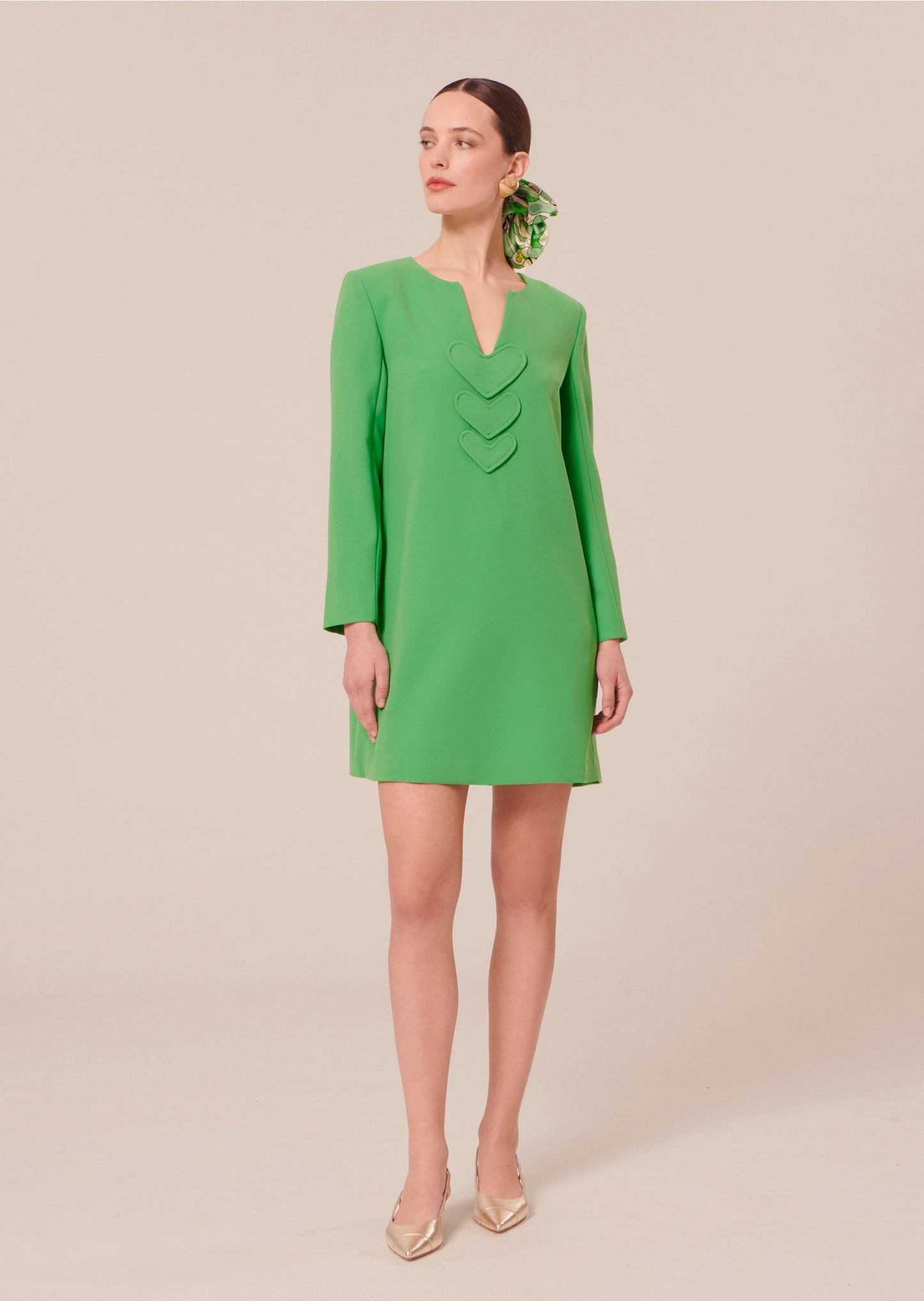 Model wearing Tara Jarmon Short Green Crepe Dress with Heart Details.
