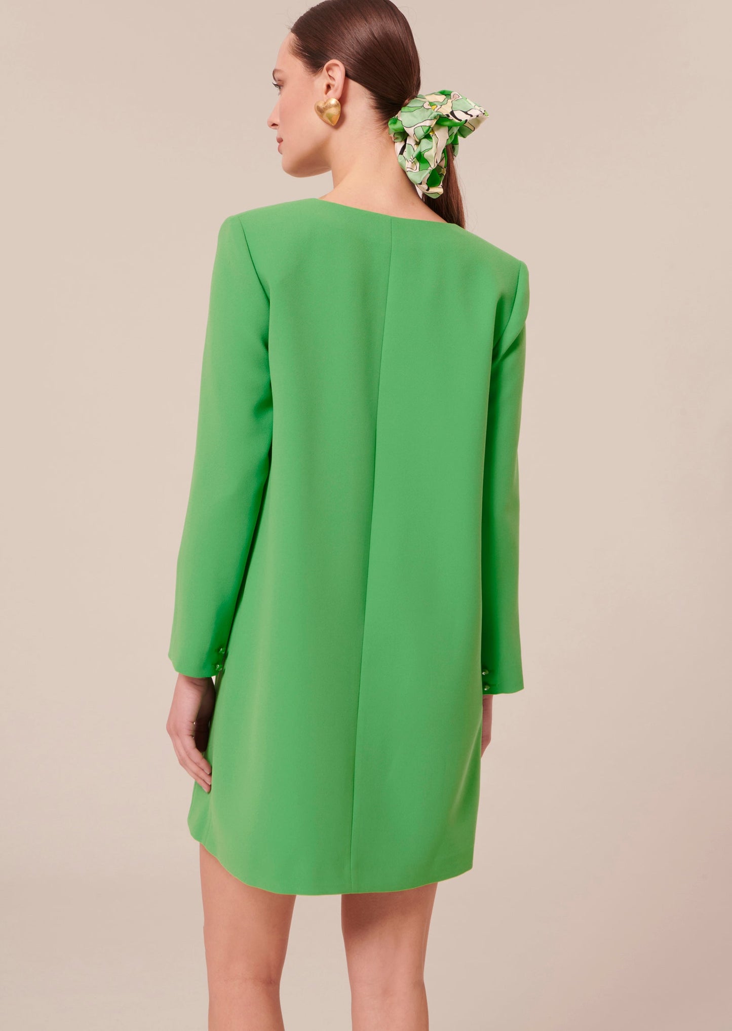 Straight cut short green crepe dress.