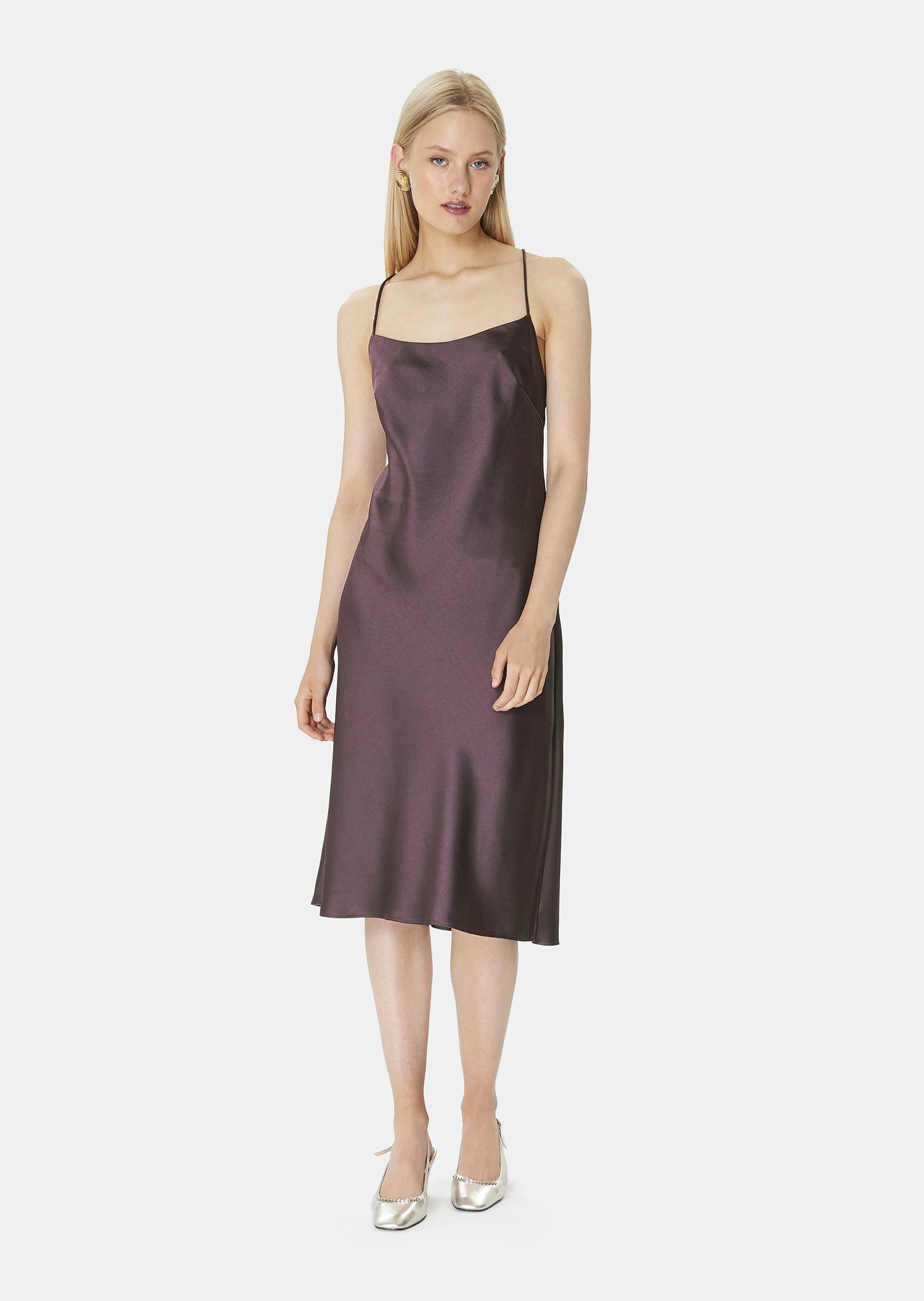 Model wearing Tara Jarmon Chocolate Satin Dress with Cross-Back Straps and Side Slit.