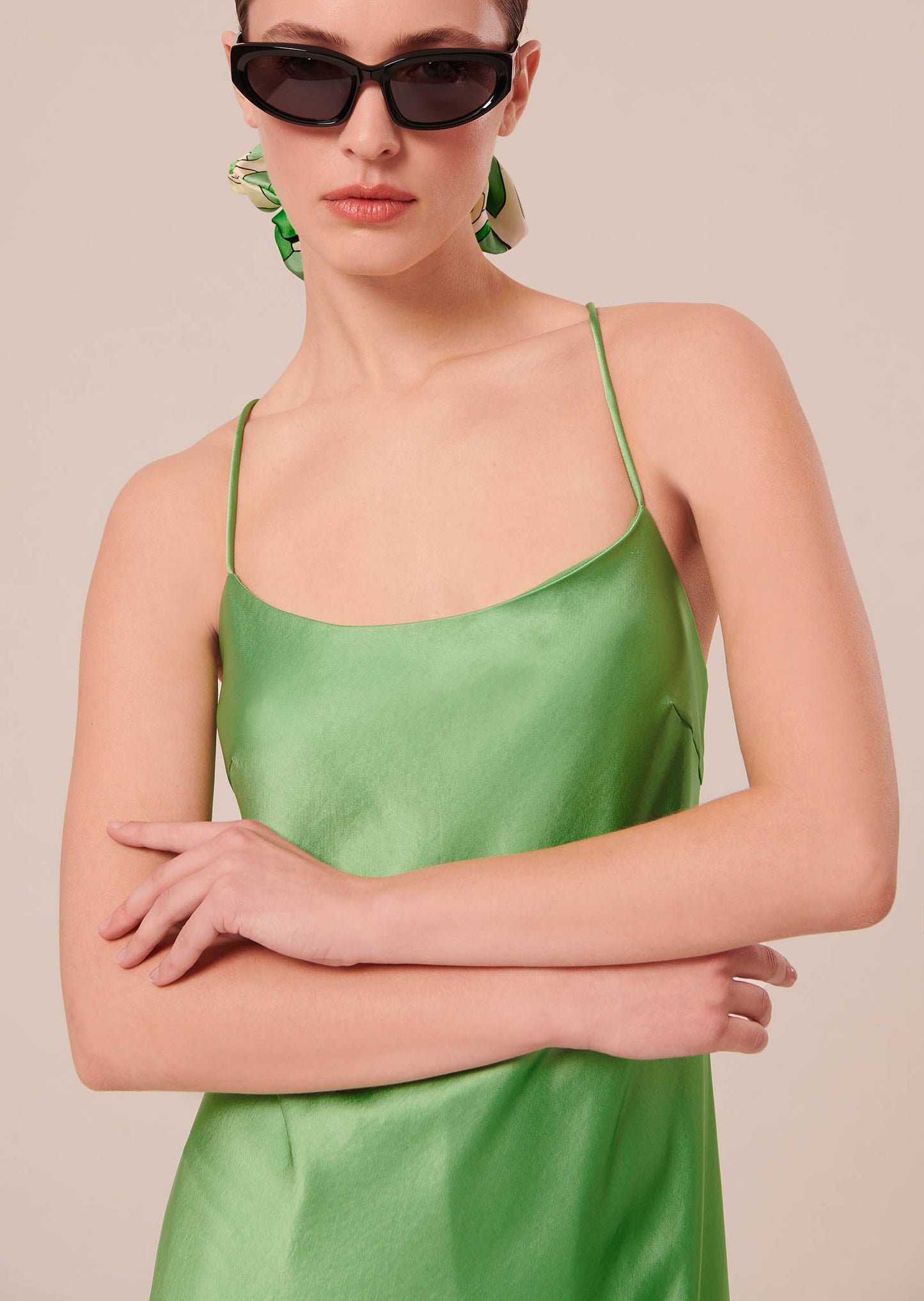 Green flowing satin dress.