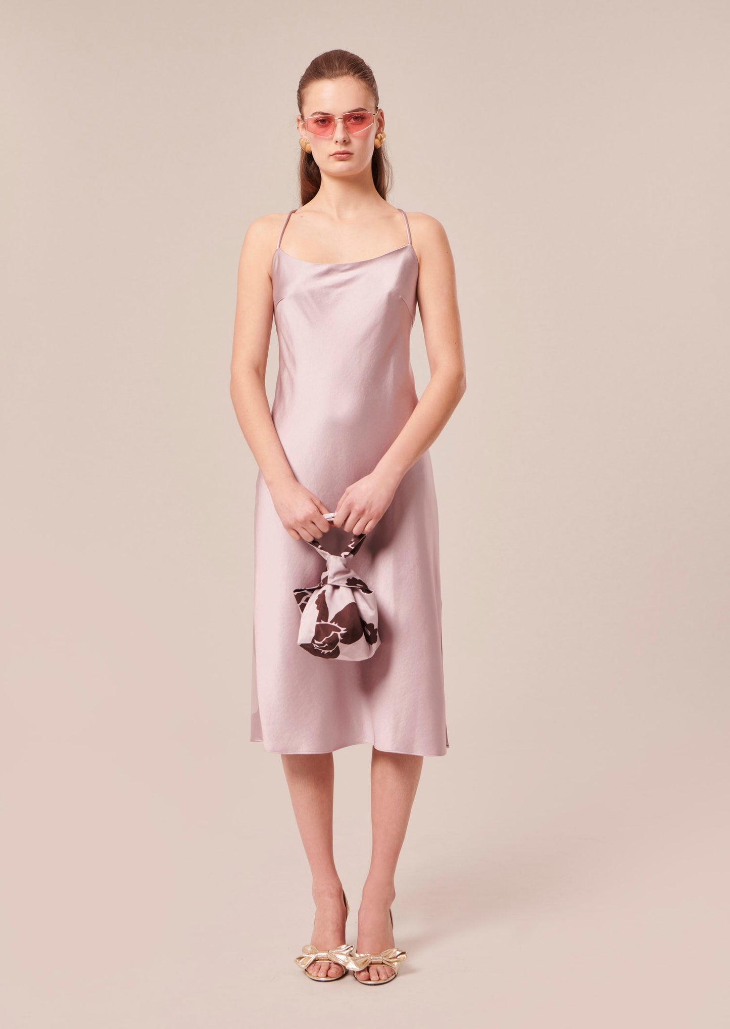 Model wearing Tara Jarmon Light Purple Satin Dress with Cross-Back Straps and Side Slit.