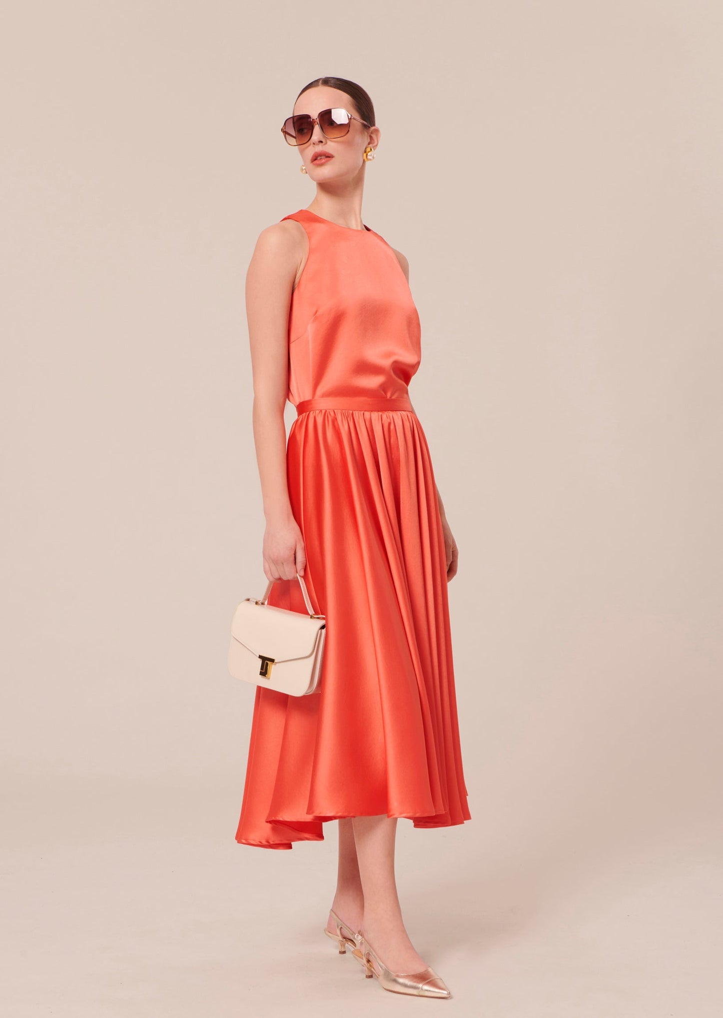 Relaxed Fit Coral Satin Top, with Back Button Closure Matching with a Long Coral Satin skirt.