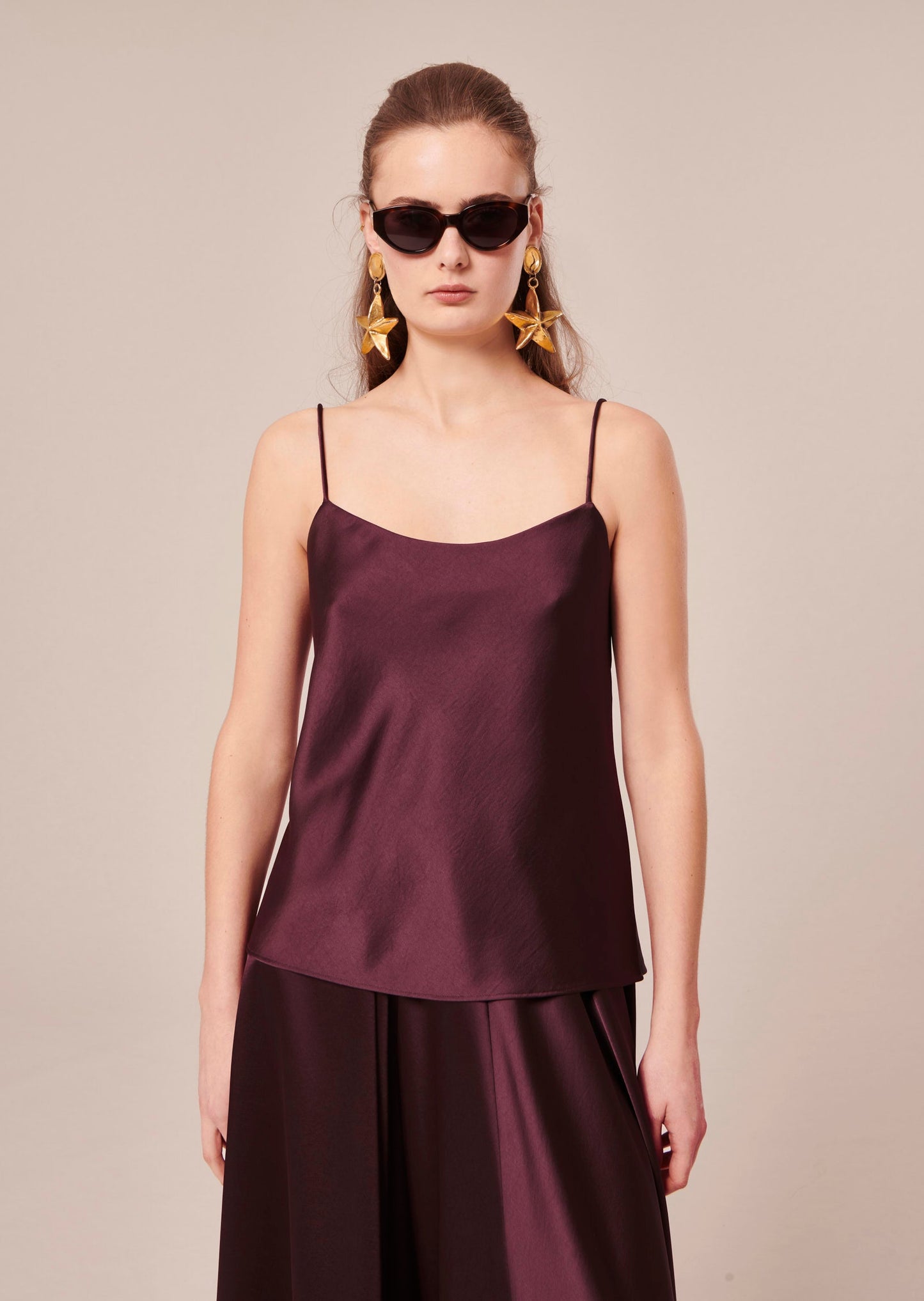 Chocolate Brown flowing satin tank top with thin straps.