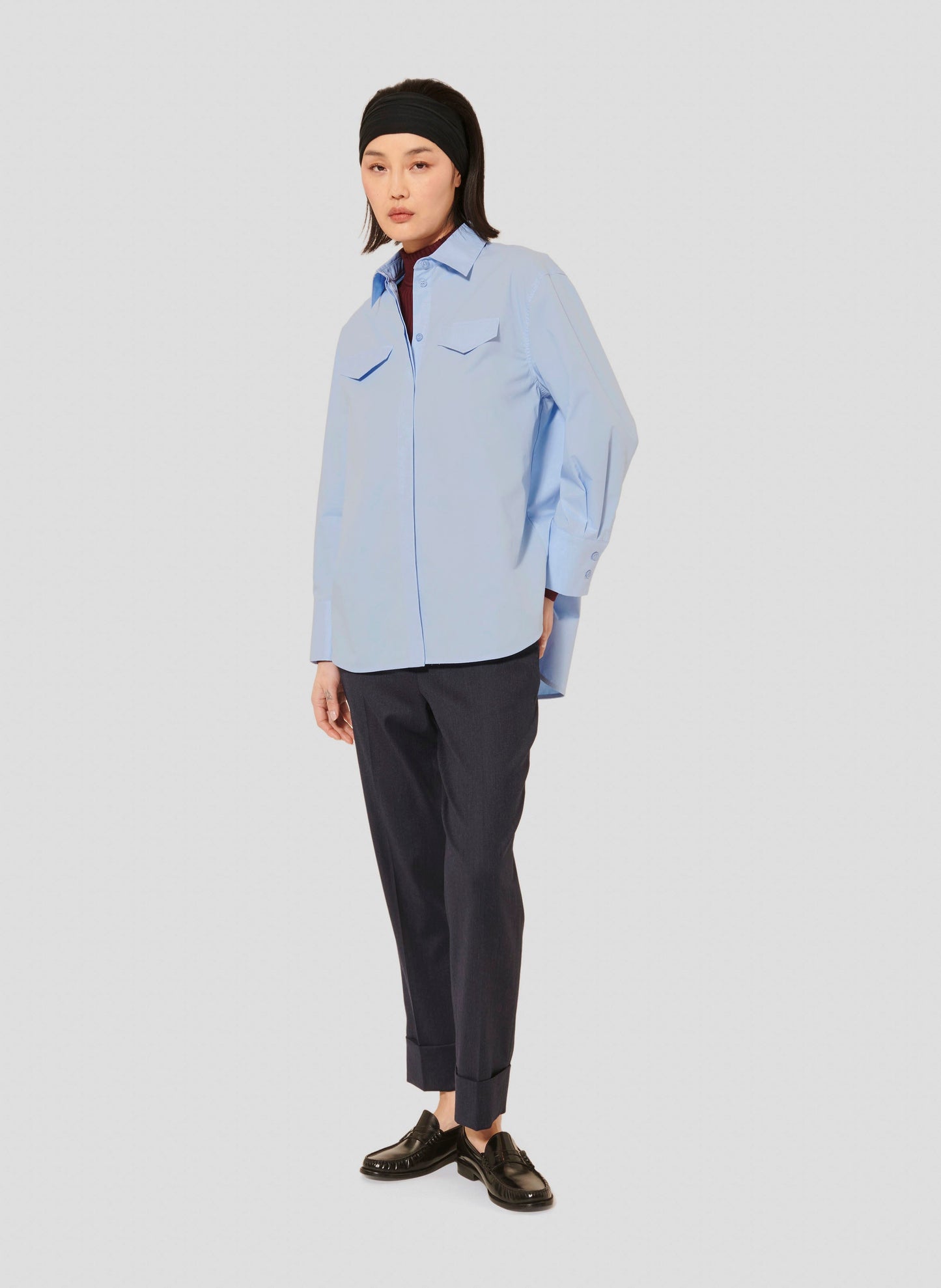 Light Blue Classic Shirt with Button-Down Collar and Hidden Button Closure.