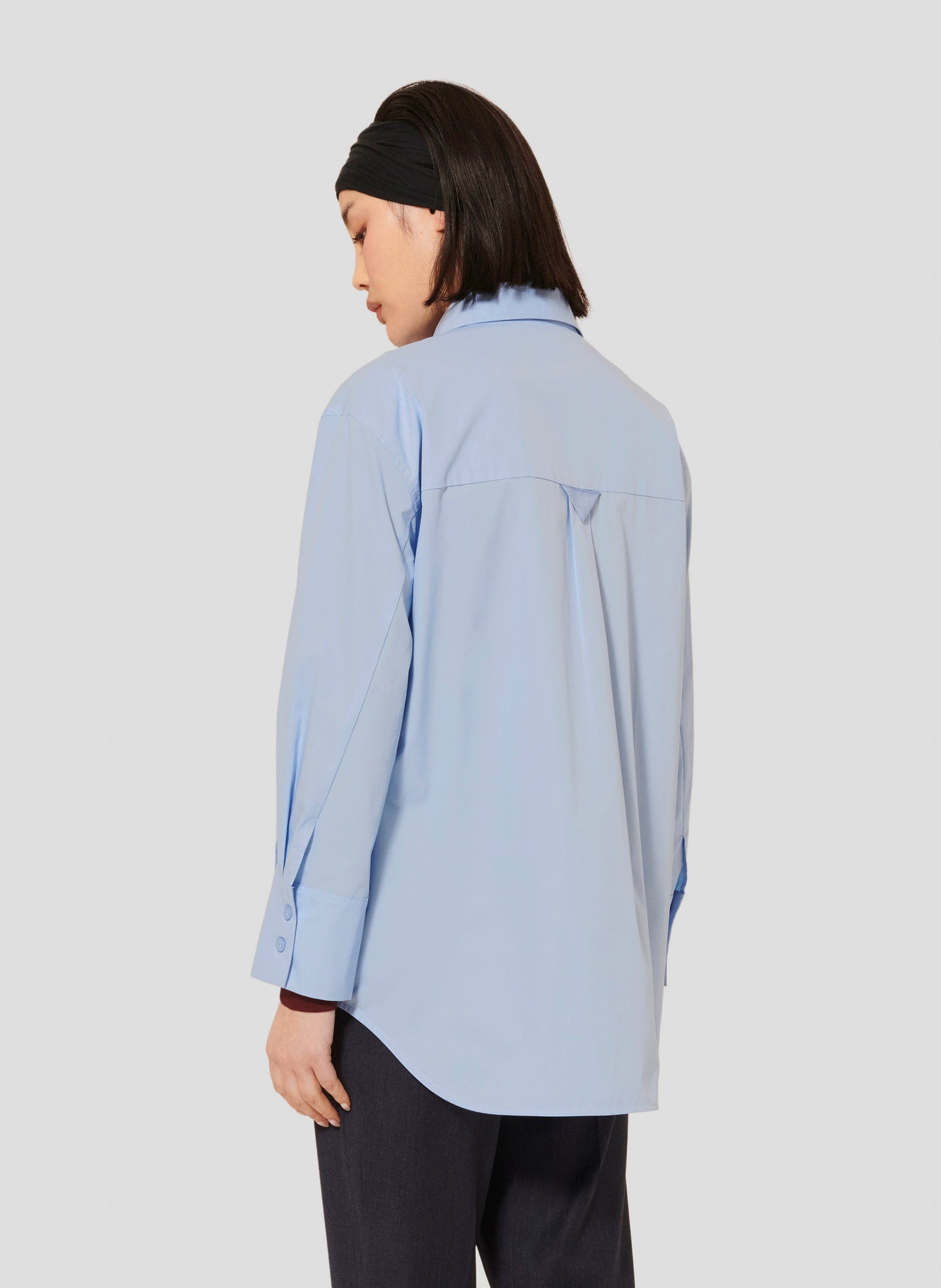 Light blue long sleeves shirt.