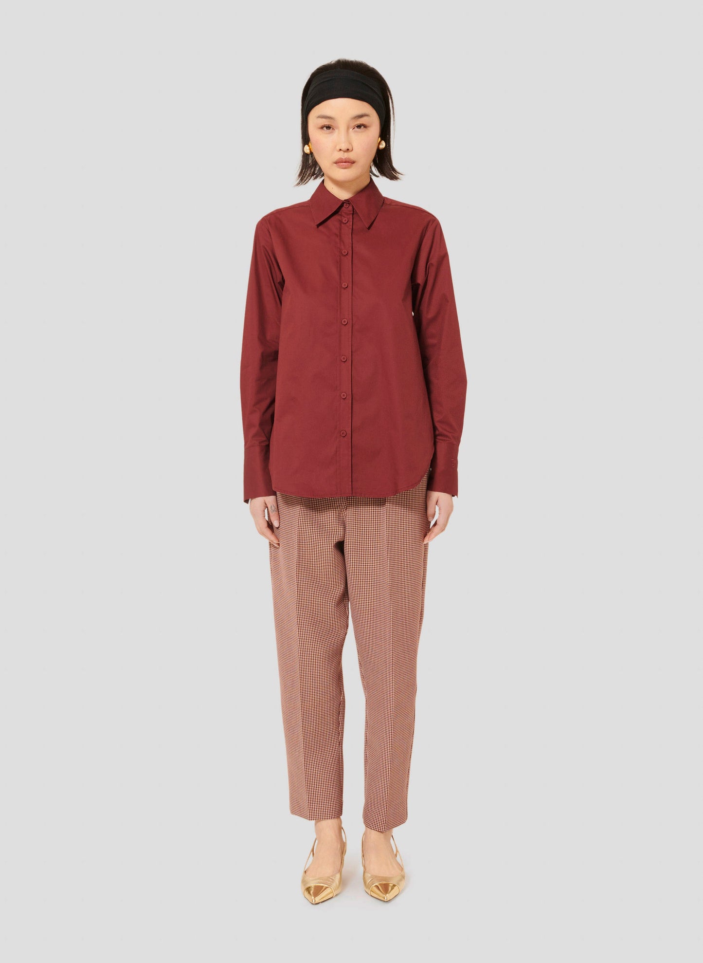 Modern Burgundy Shirt with Buttoned Cuffs and Embroidered Tara Jarmon Logo with Straight Cut Burgundy Pants.