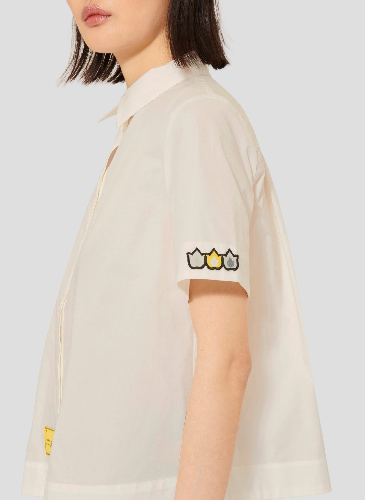White poplin cotton shirt with flame design on sleeves.