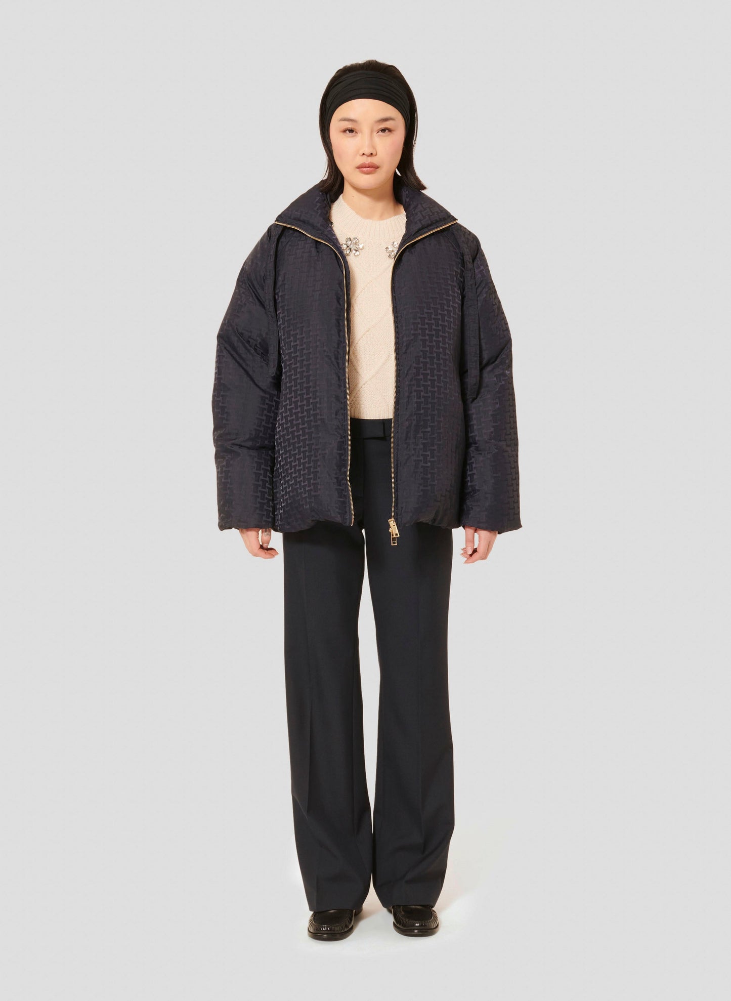 Versatile Midnight Blue Jacket with Gold Zipper and Side Pockets.
