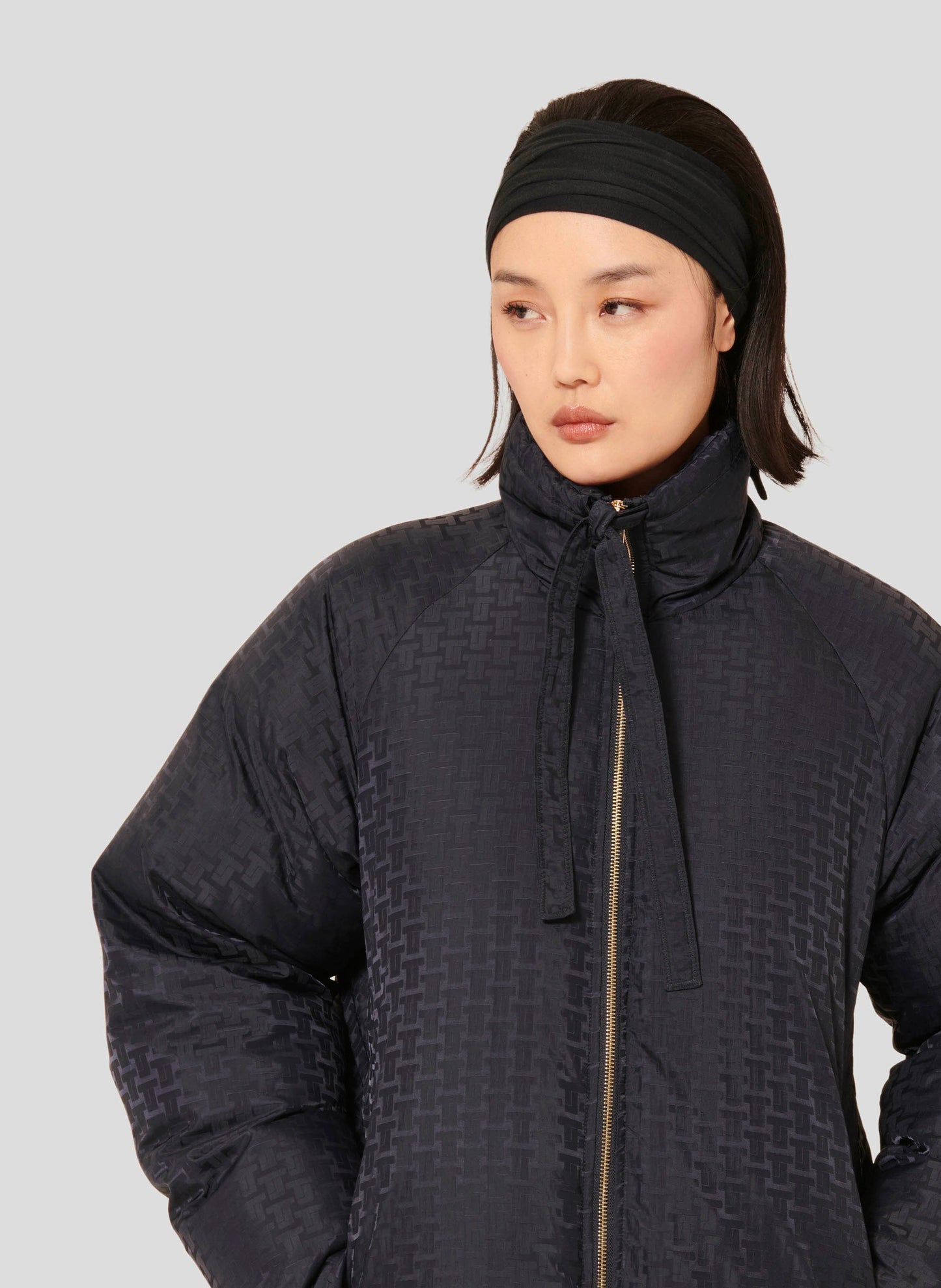 Midnight Blue Down Jacket with High Collar and Double Zipper.
