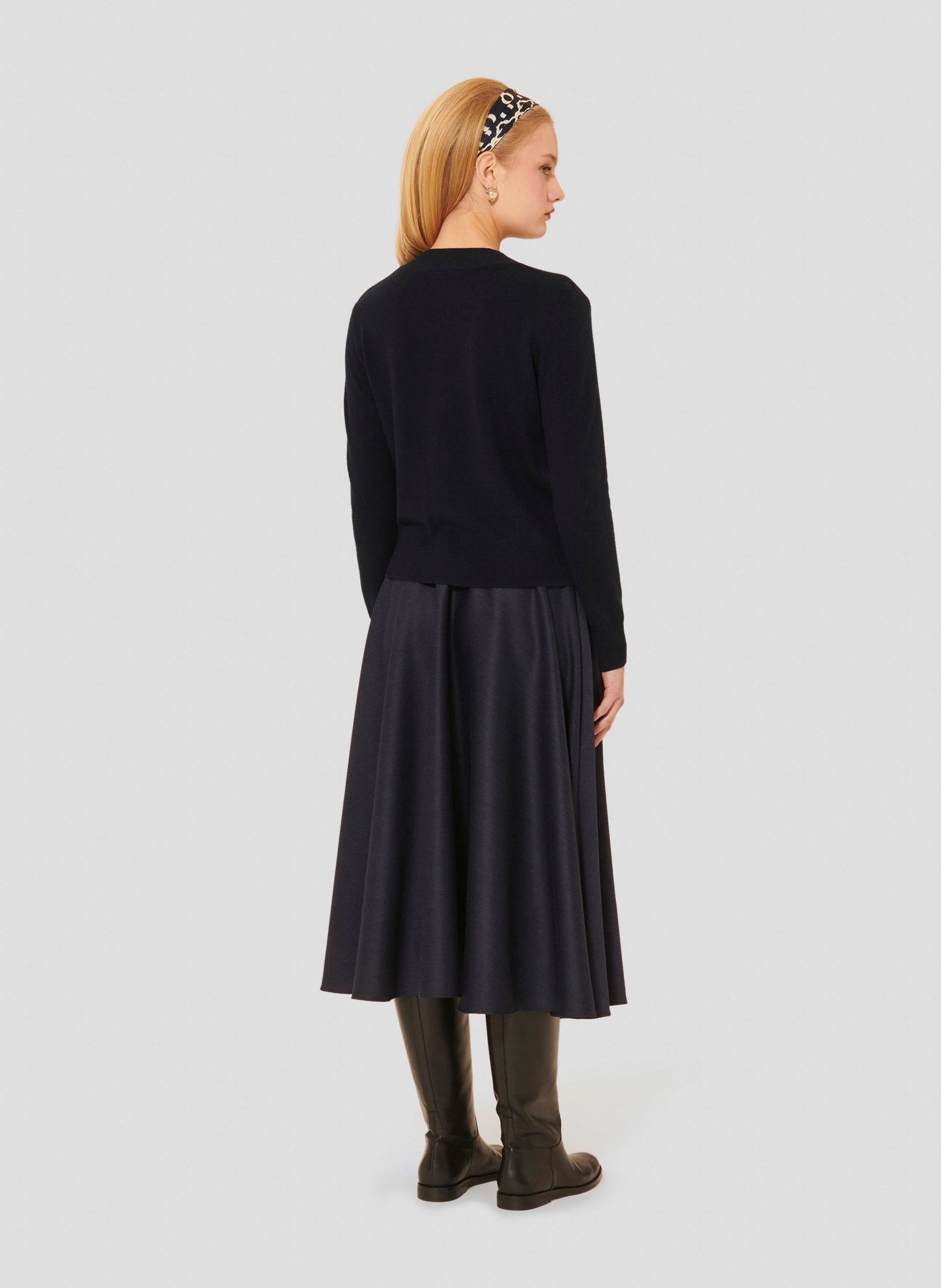 Navy wool sweater matching with an over the knee navy skirt.