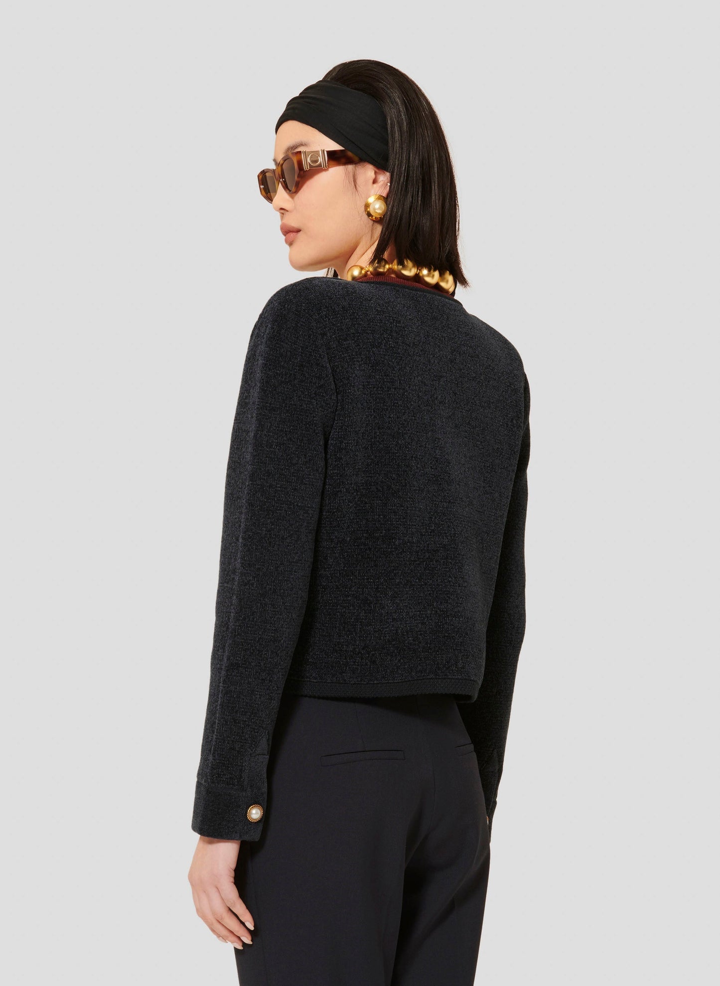 Midnight blue compact knit cardigan with pearl cuffs.