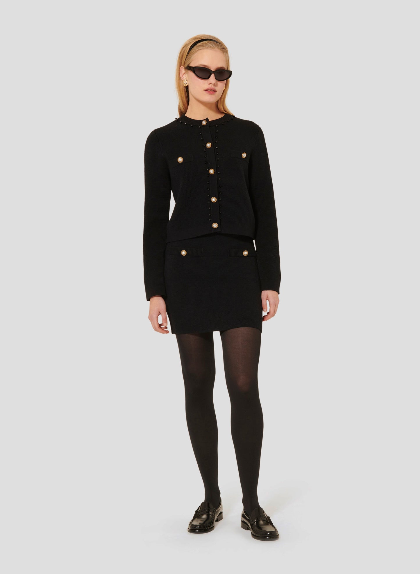 Tara Jarmon model wearing black knitted skirt