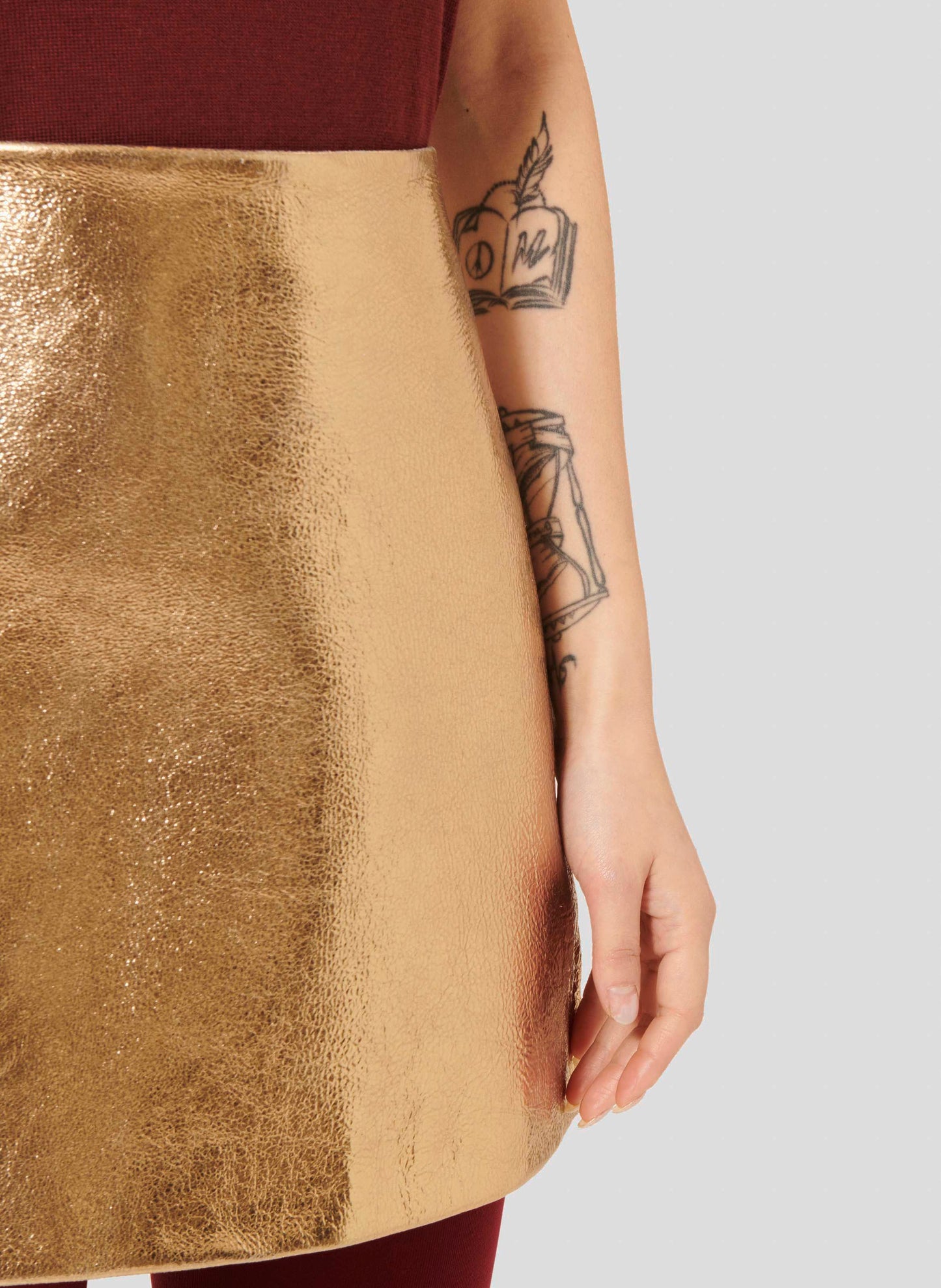 Leather Skirt in Gold with A-Line Silhouette.