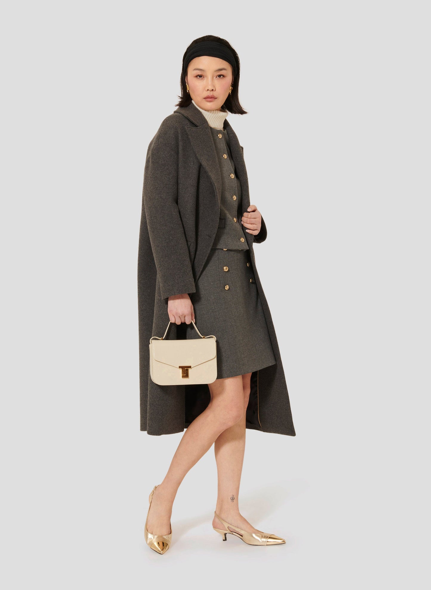 Long Gray Wool Coat with Flap Pockets and Single Button.