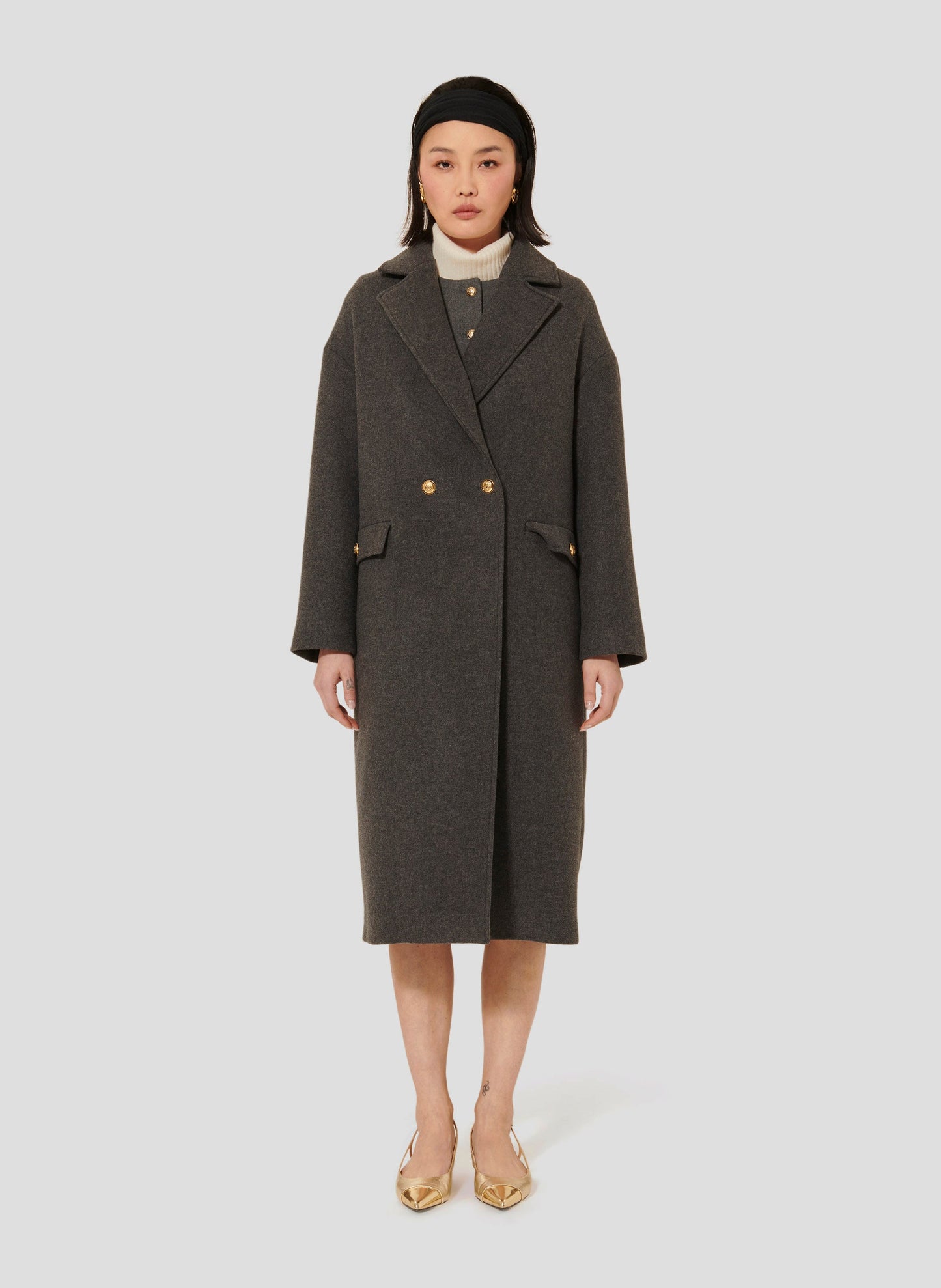 Gray Sheepskin Coat with Lapel Collar and Gold Button Closure.