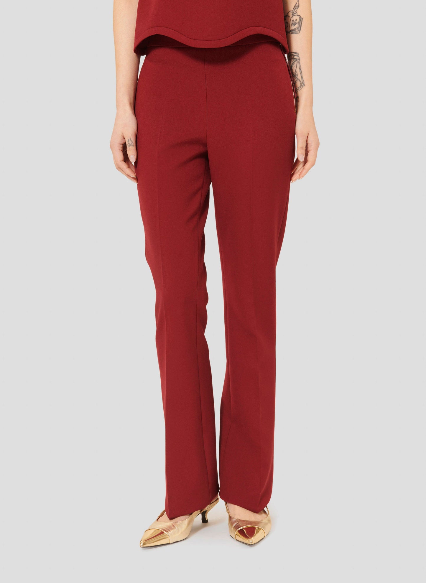 Comfortable Burgundy Pants with Mid-Rise Waist and Stretch Fabric.