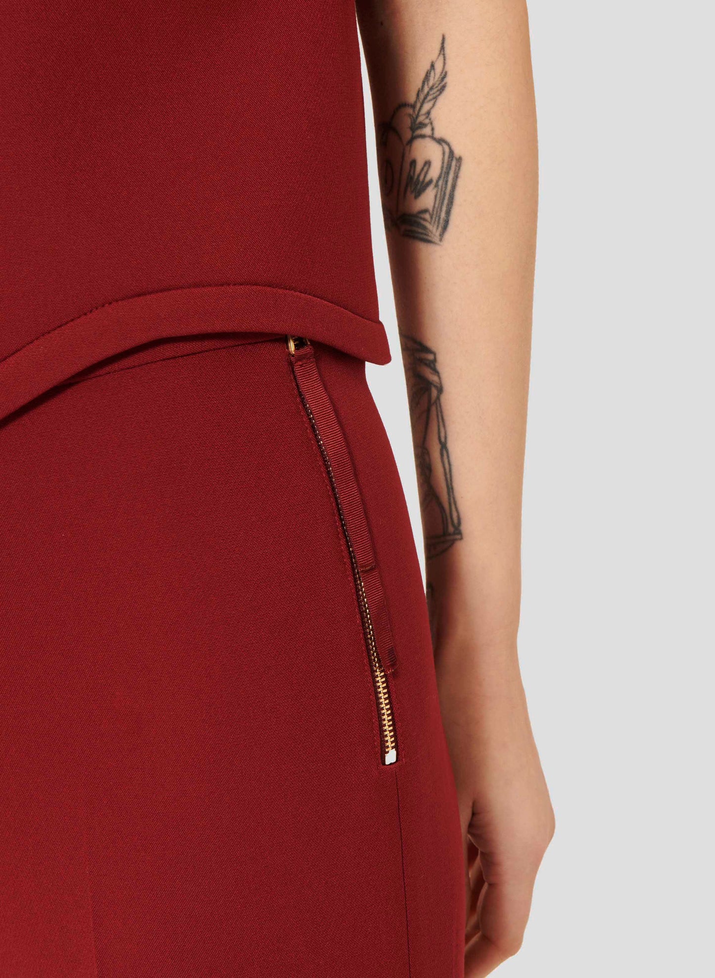 Stylish Burgundy Pants with Minimalist Design and Side Zipper.