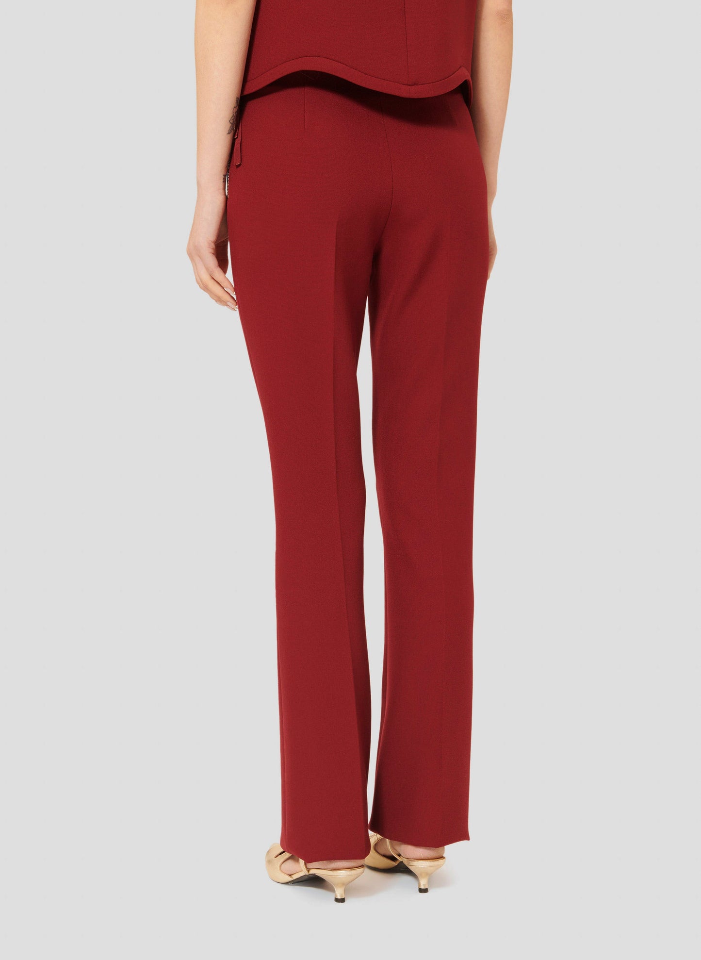 Versatile Burgundy Pants with Figure-Hugging Fit and Side Zip.
