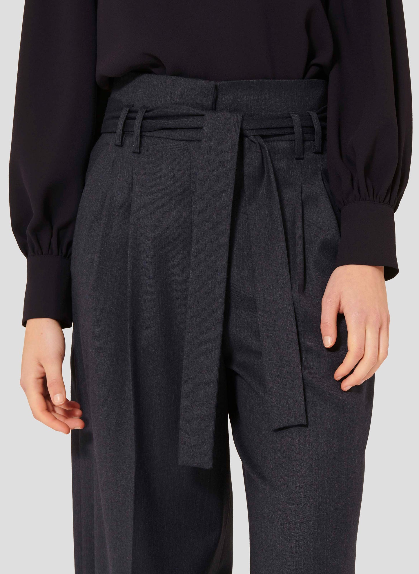 High-waist midnight blue wide-leg flannel pants with a belted waist, side pockets, and cuffed hems.