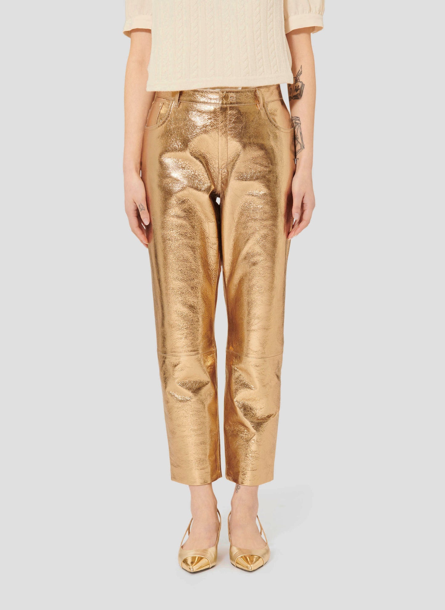 Model wearing Tara Jarmon Gold Leather Pants with 7/8 Length and Belt Loops.