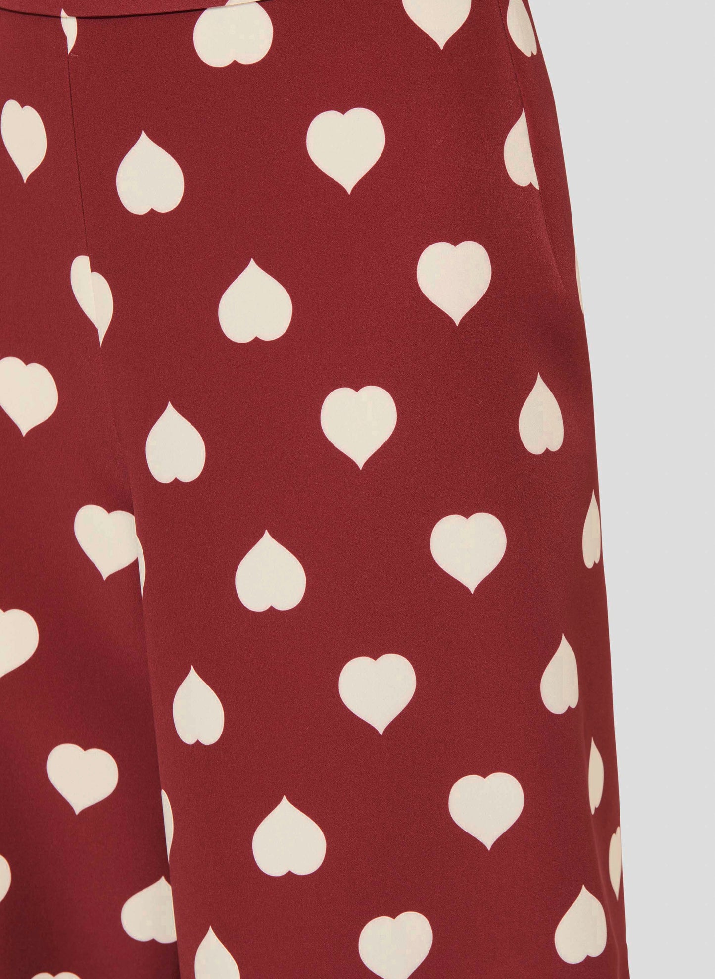 Versatile Burgundy Pants with Ecru Heart Print.
