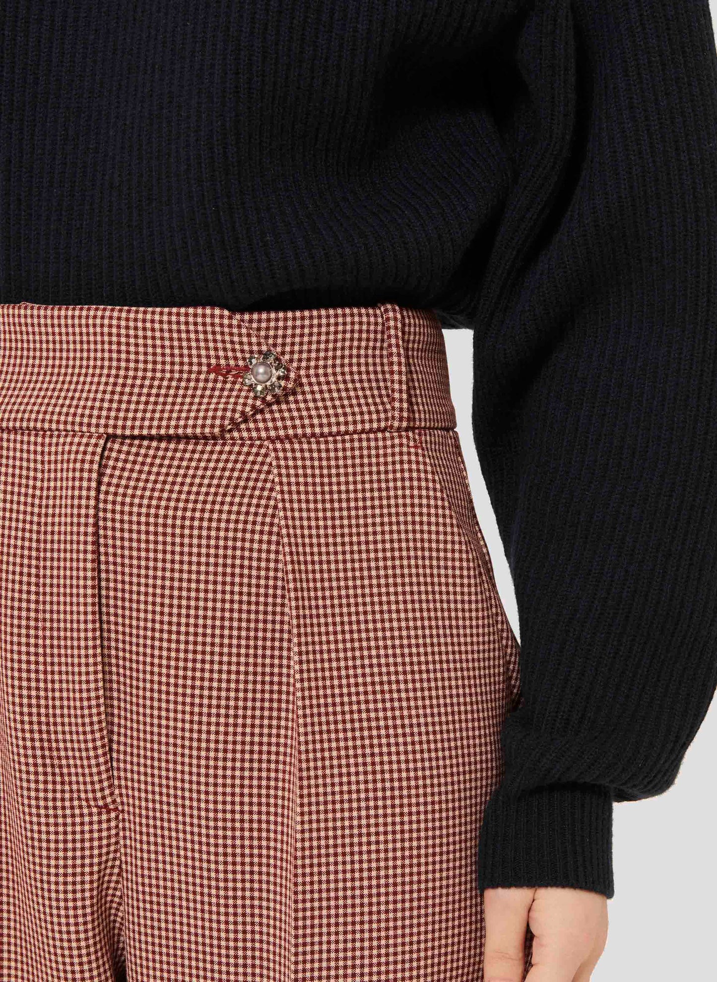 Burgundy 7/8th cut pants with silver jewel button closure.