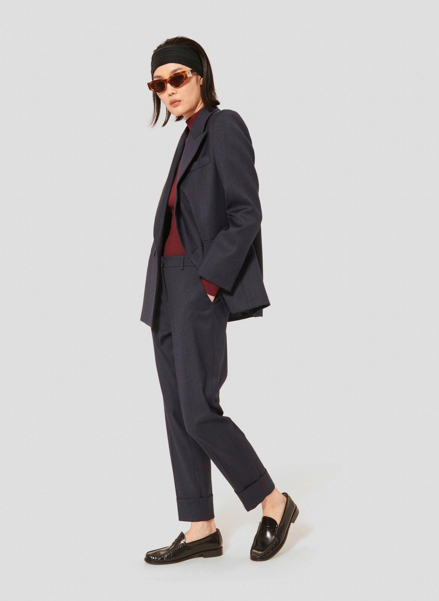 Cropped Pants in Dark Blue with Flat Front and Belt Loops matching with A Dark Blue Jacket.