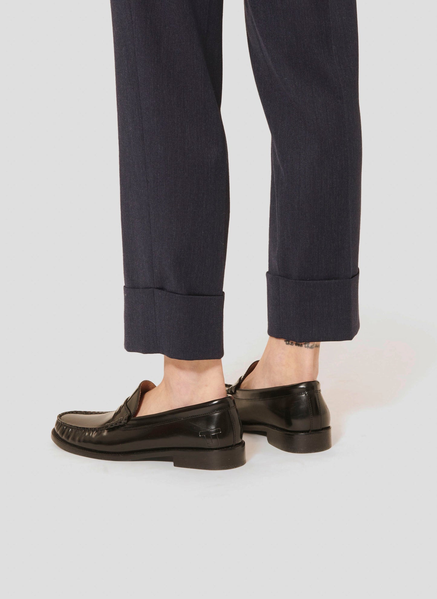 Cropped cut midnight blue pants.