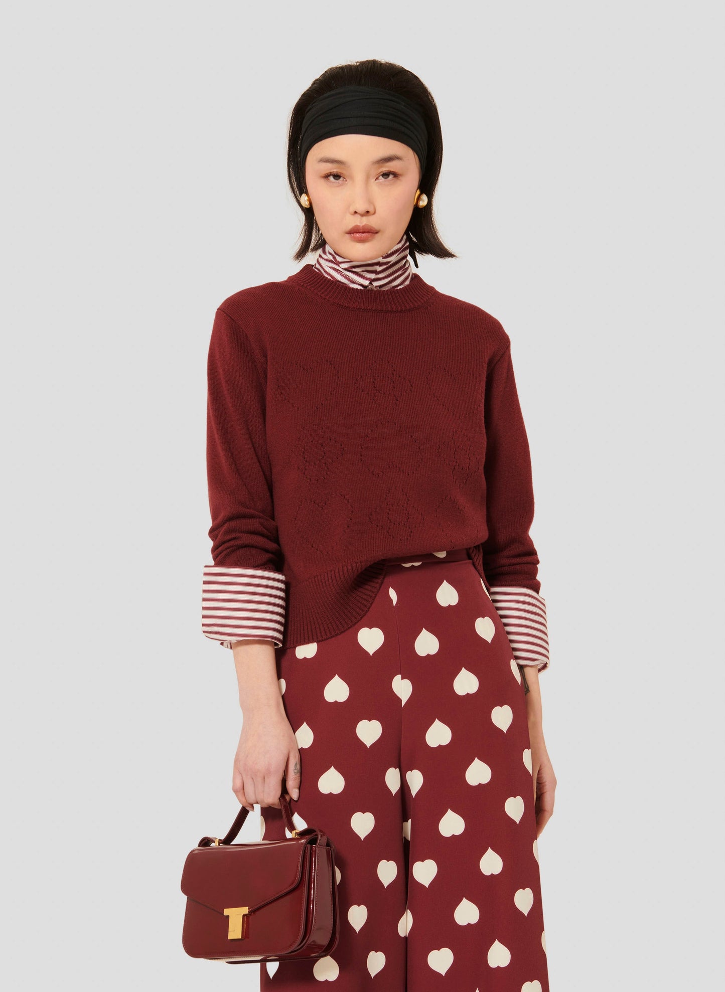 Burgundy Merino Wool Sweater with Ribbed Trim and Embroidered Detail Matching with High-waist Burgundy Pants.