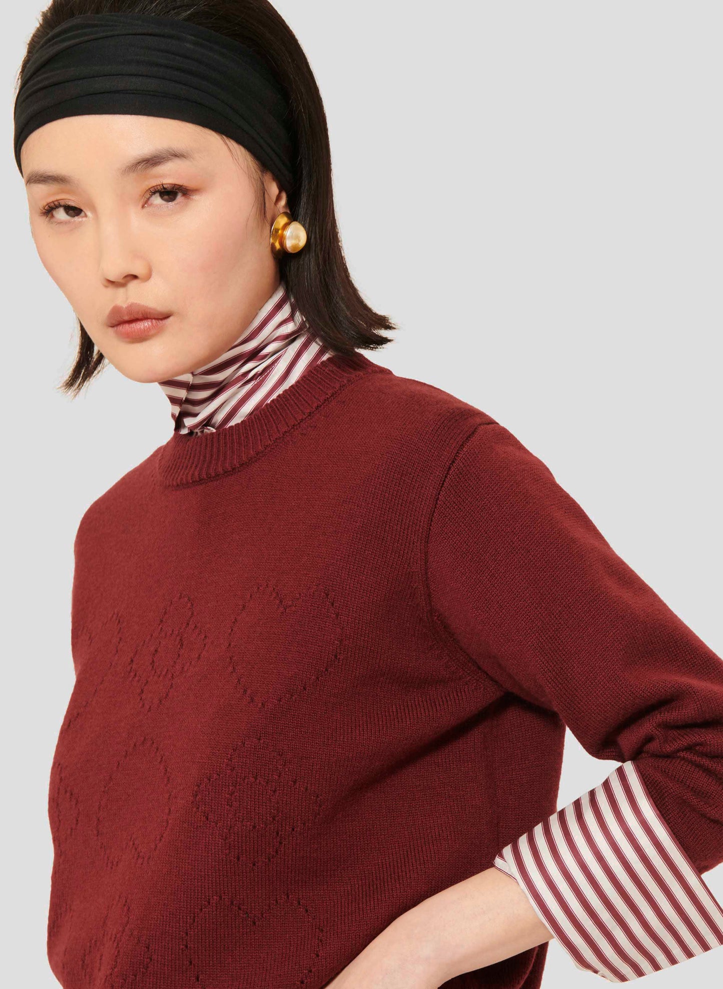 Versatile Sweater in Burgundy with Ribbed Cuffs and Hem.