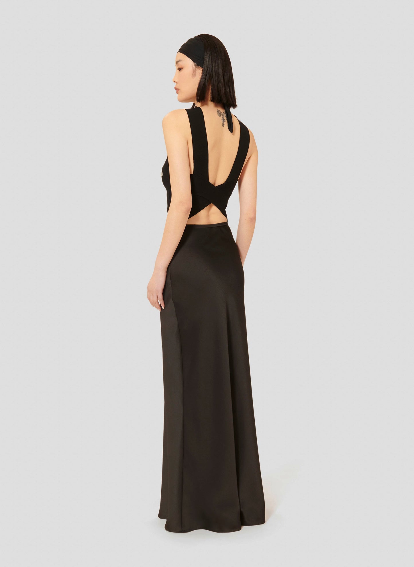 Sleeveless Black Top with Criss-Cross Back.