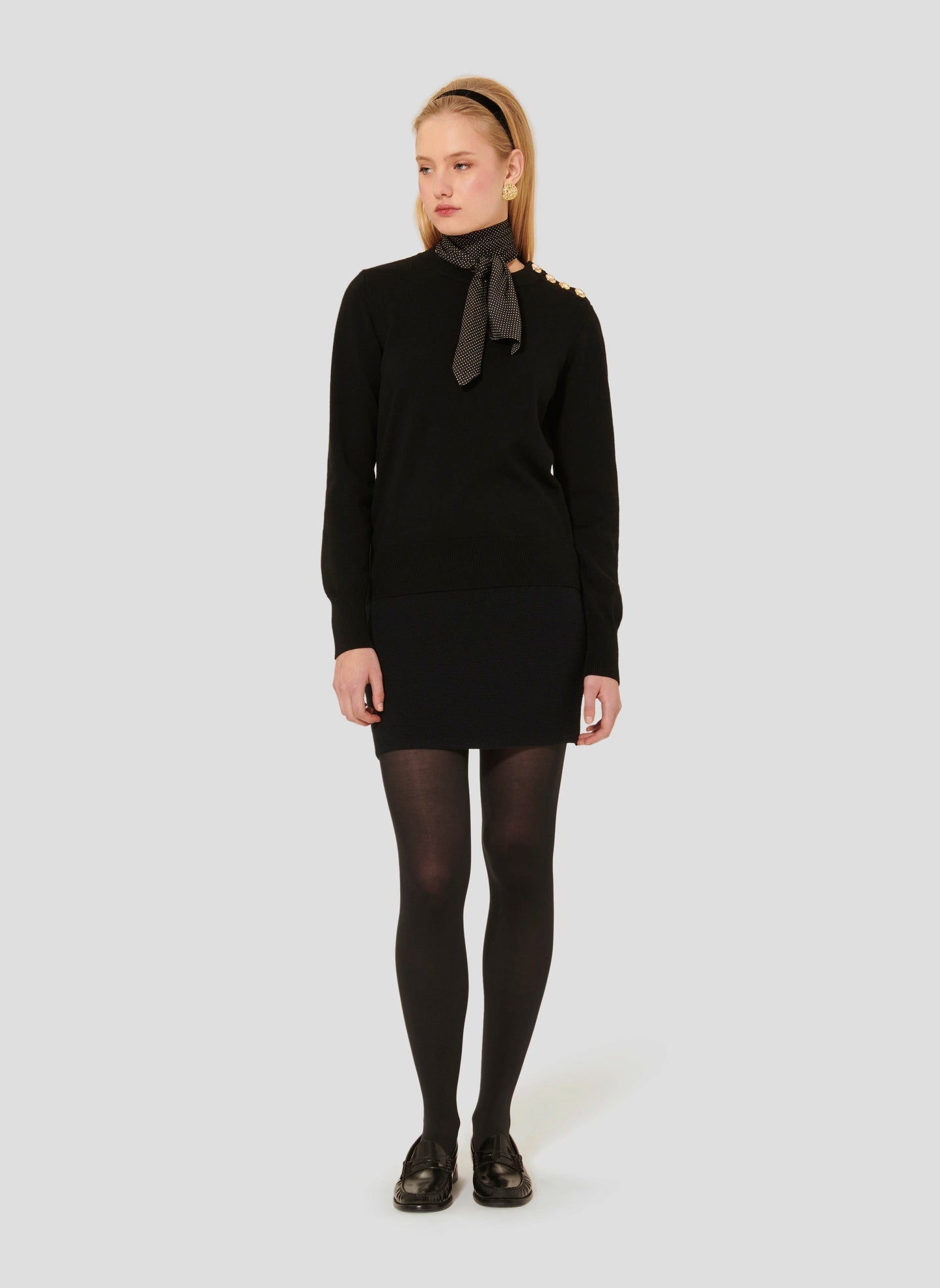 Sleek Black Sweater with V-Neck and Decorative Cuffs.
